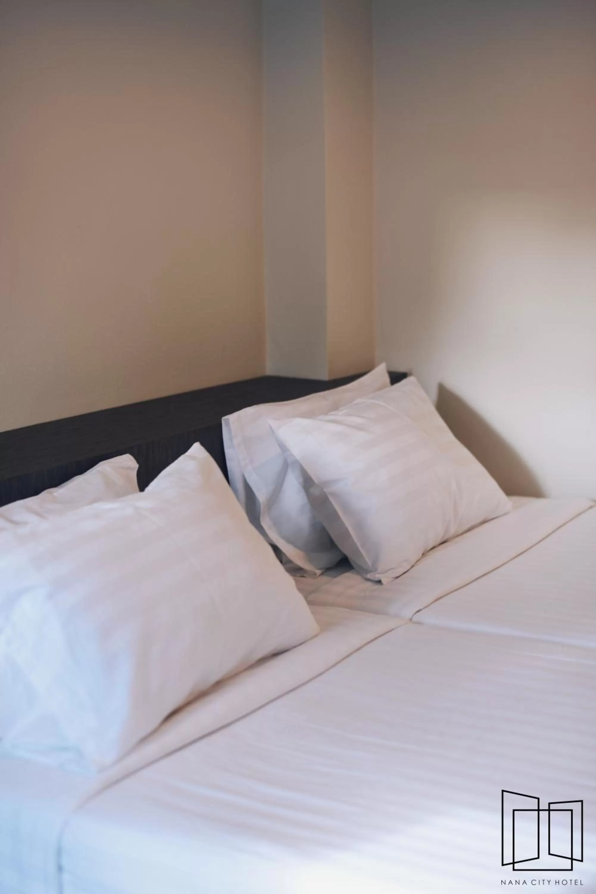 Bed in Nana City Hotel