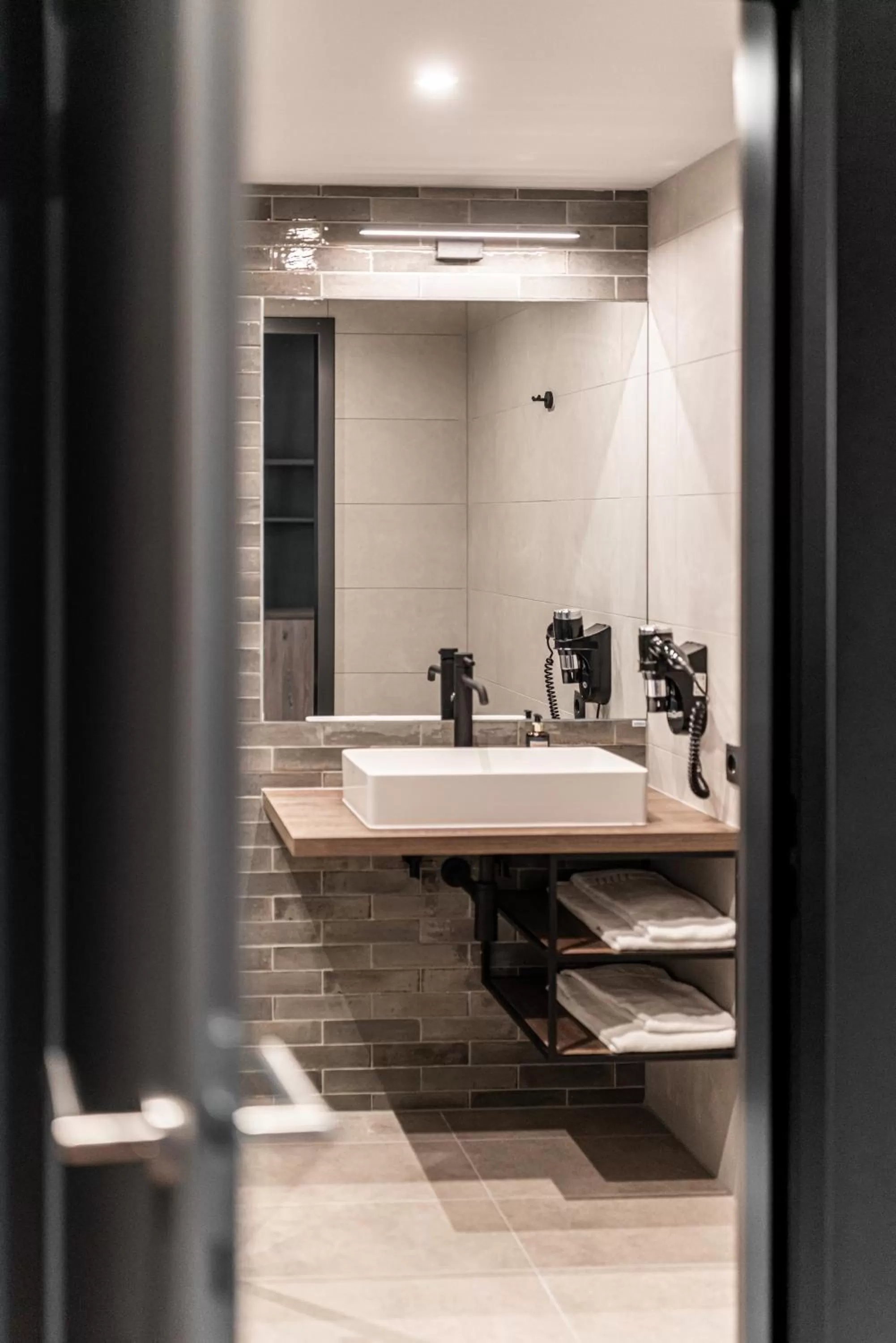 Bathroom in FreshSuites & Bar