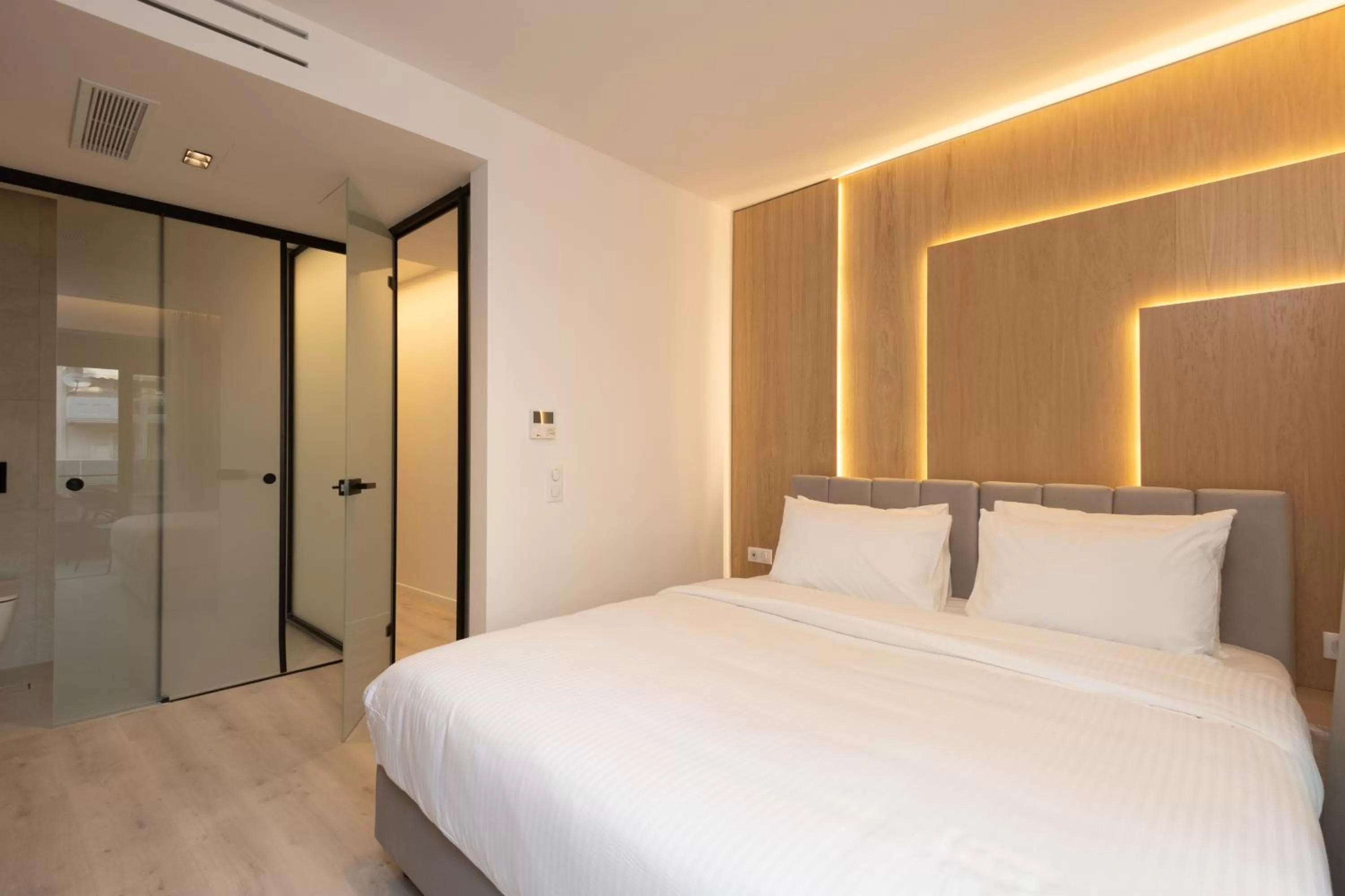 Bed in Incanto Boutique Suites - Neos Kosmos