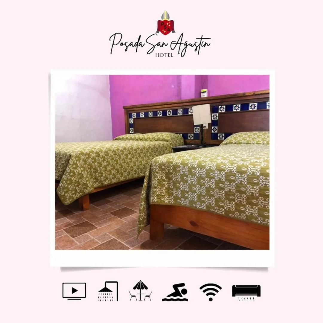 Bed in Hotel Posada San Agustin