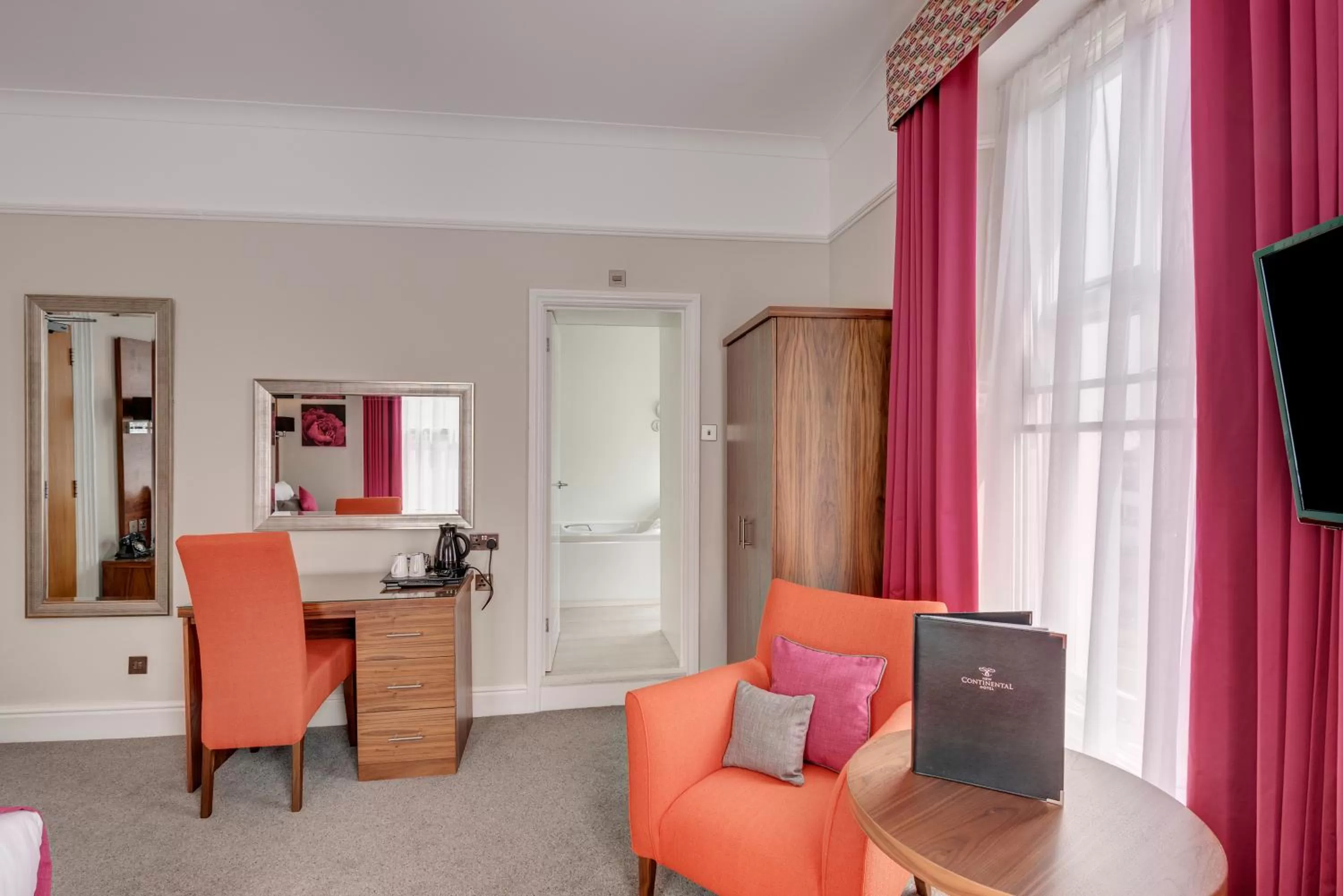 Seating area in New Continental Hotel; Sure Hotel Collection by Best Western