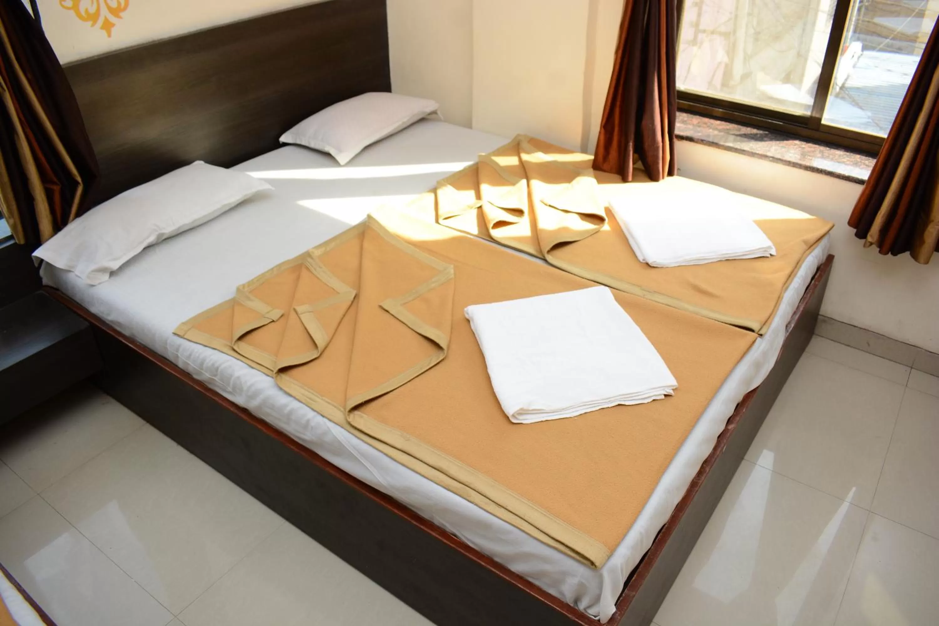 Bed in Hotel Sai Sampada NX