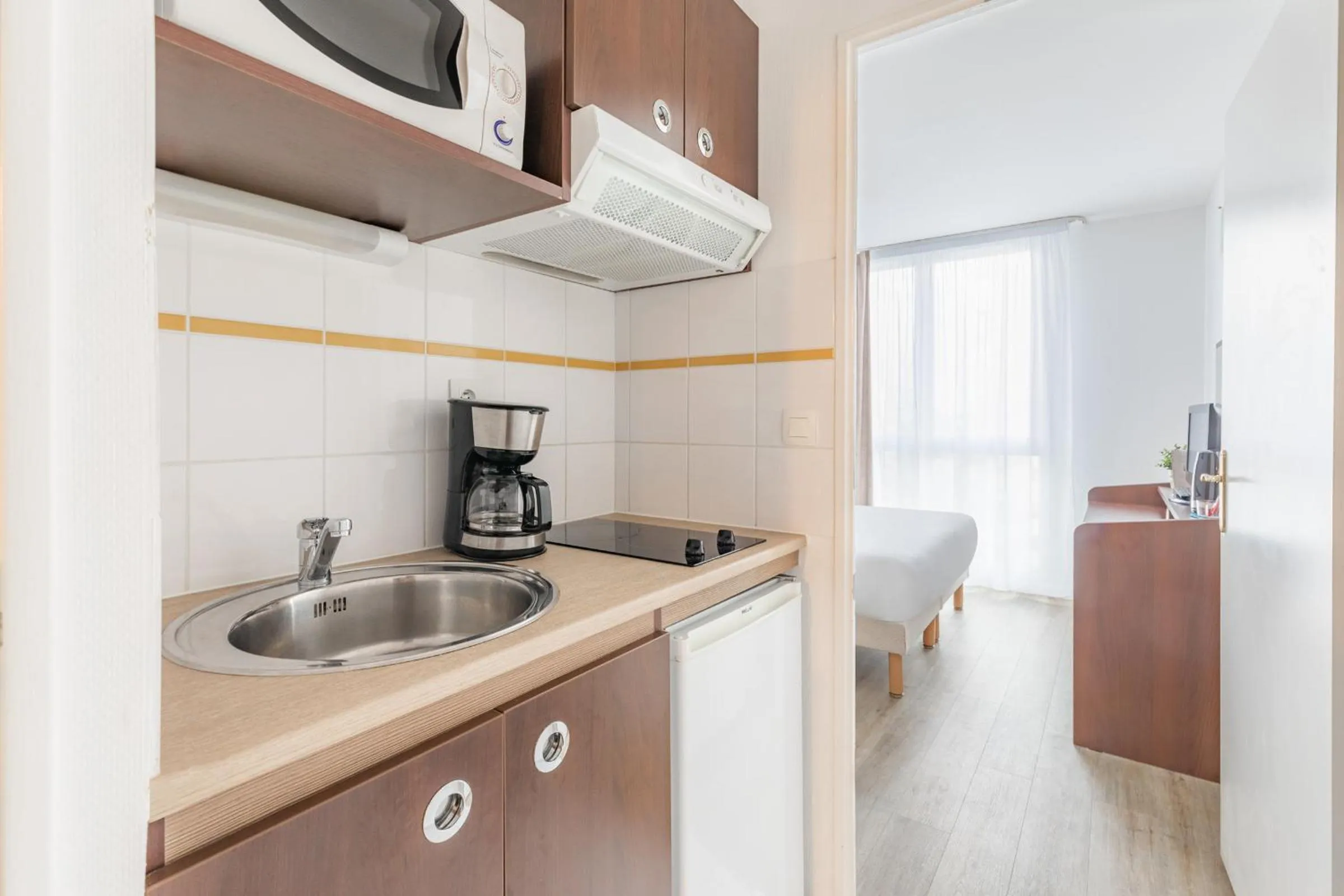Kitchen or kitchenette in Appart'City Confort Brest