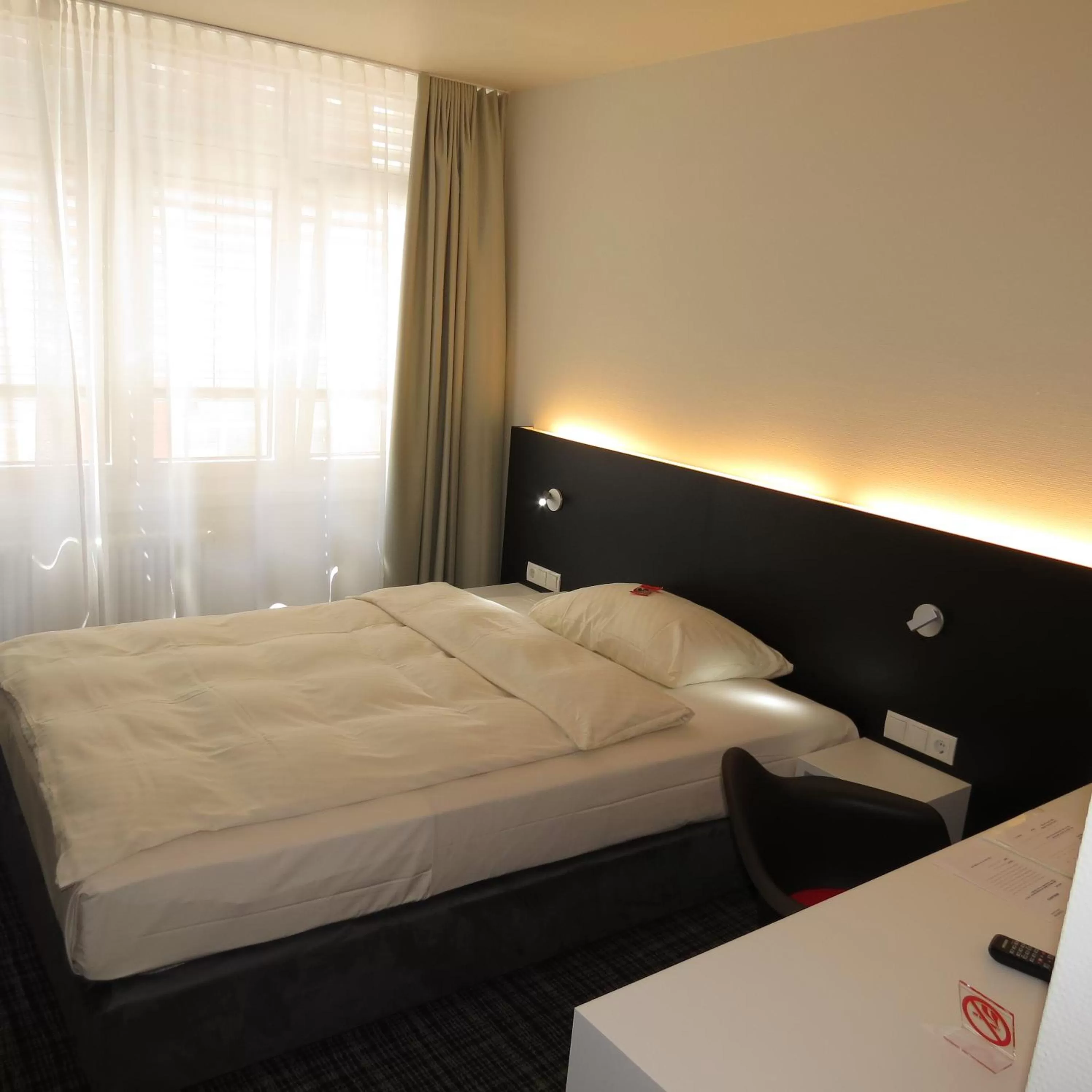 Photo of the whole room, Bed in Comfor Hotel Ulm City
