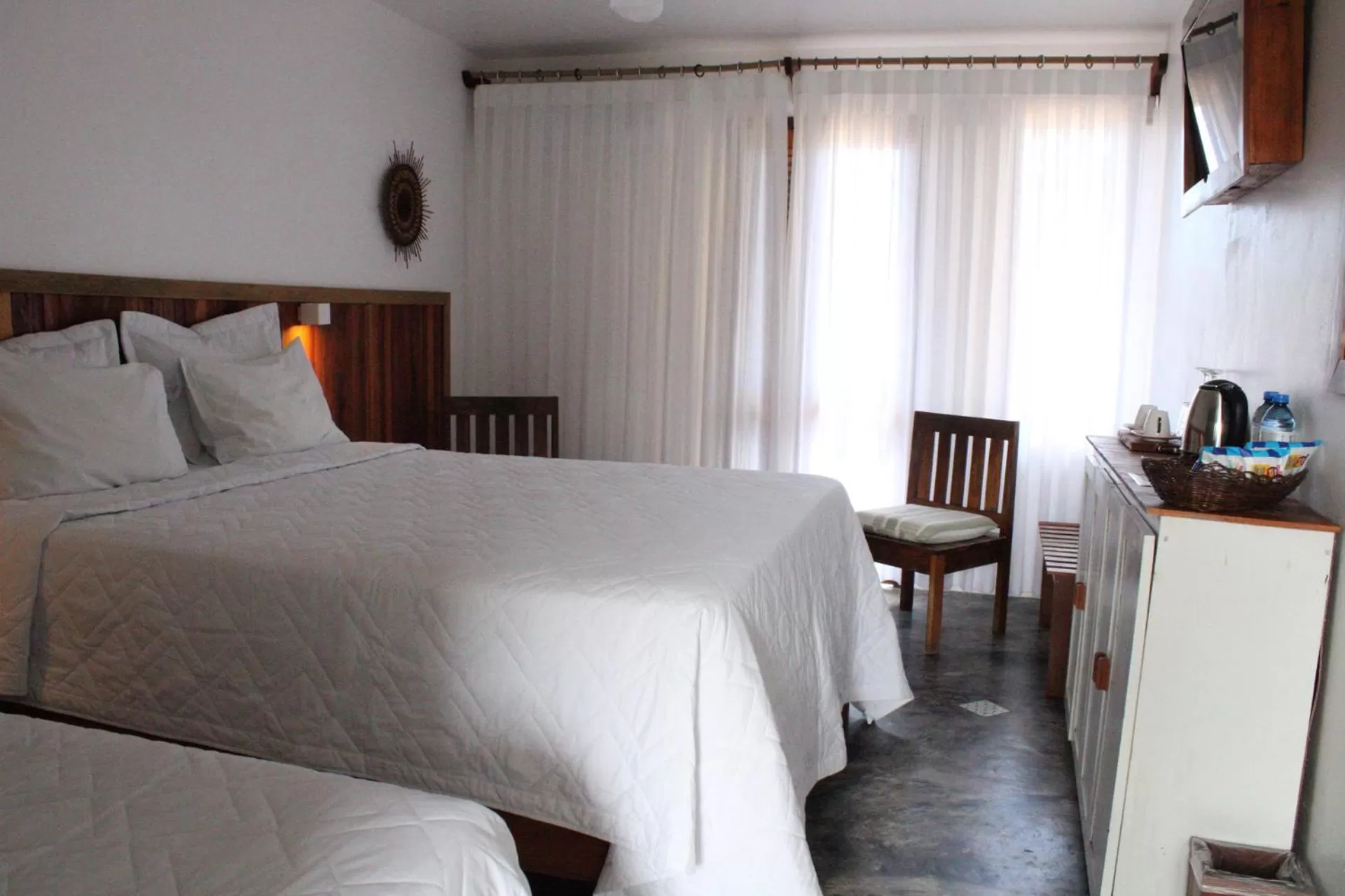 Property building, Bed in Pousada dos Hibiscus