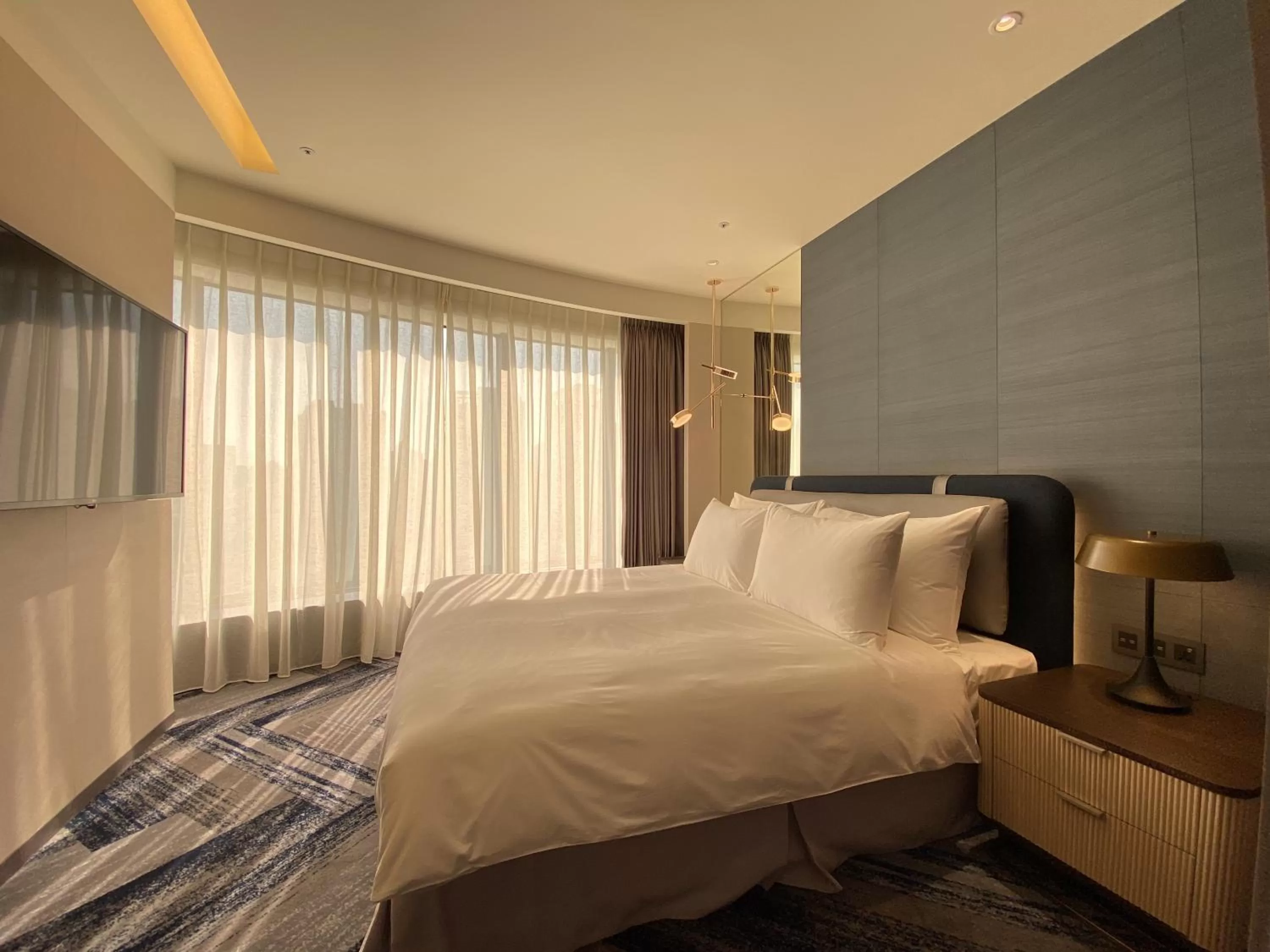 Bed in Monarch Plaza Hotel