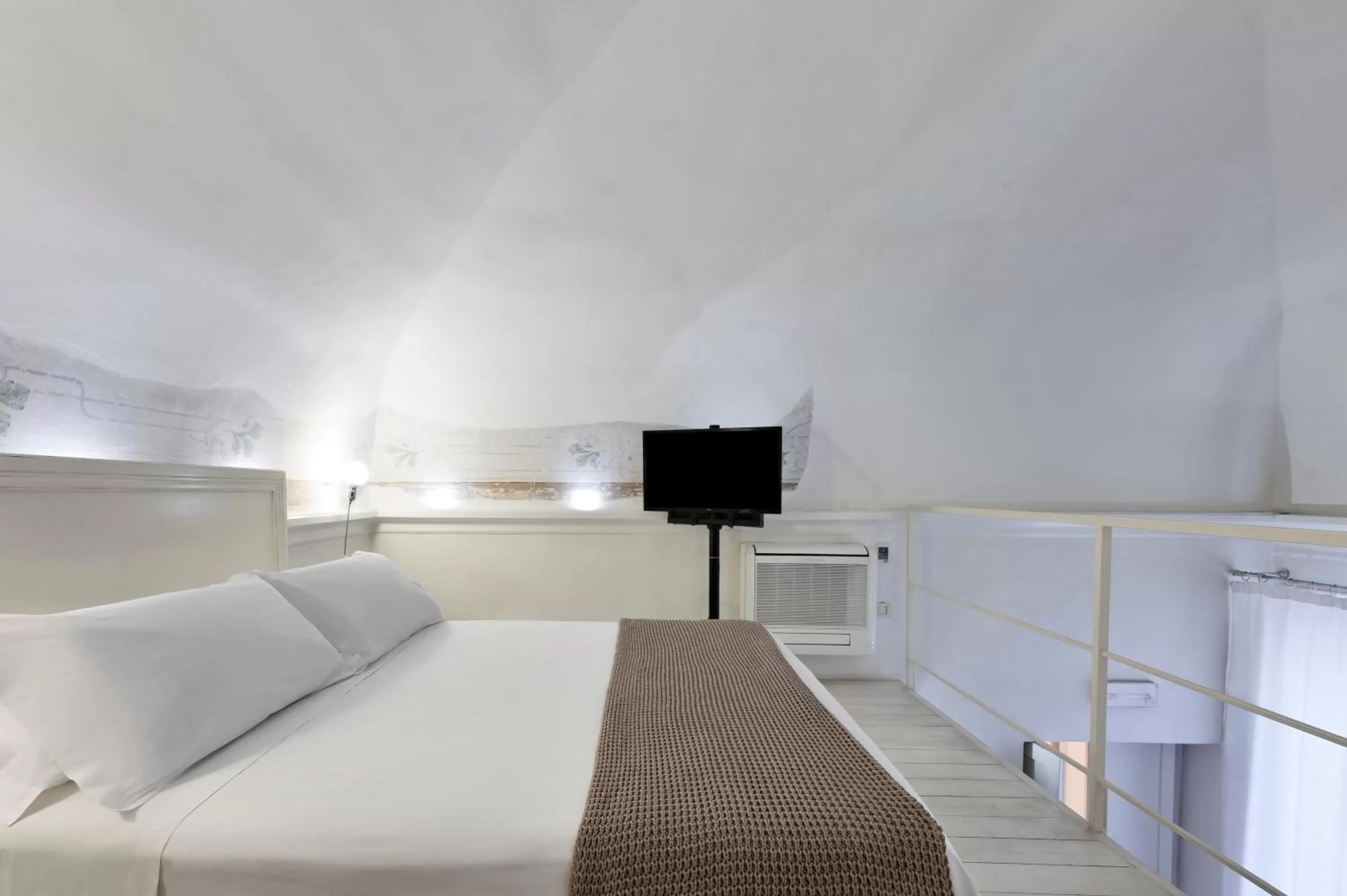 Bed in Casa di Lo Suites