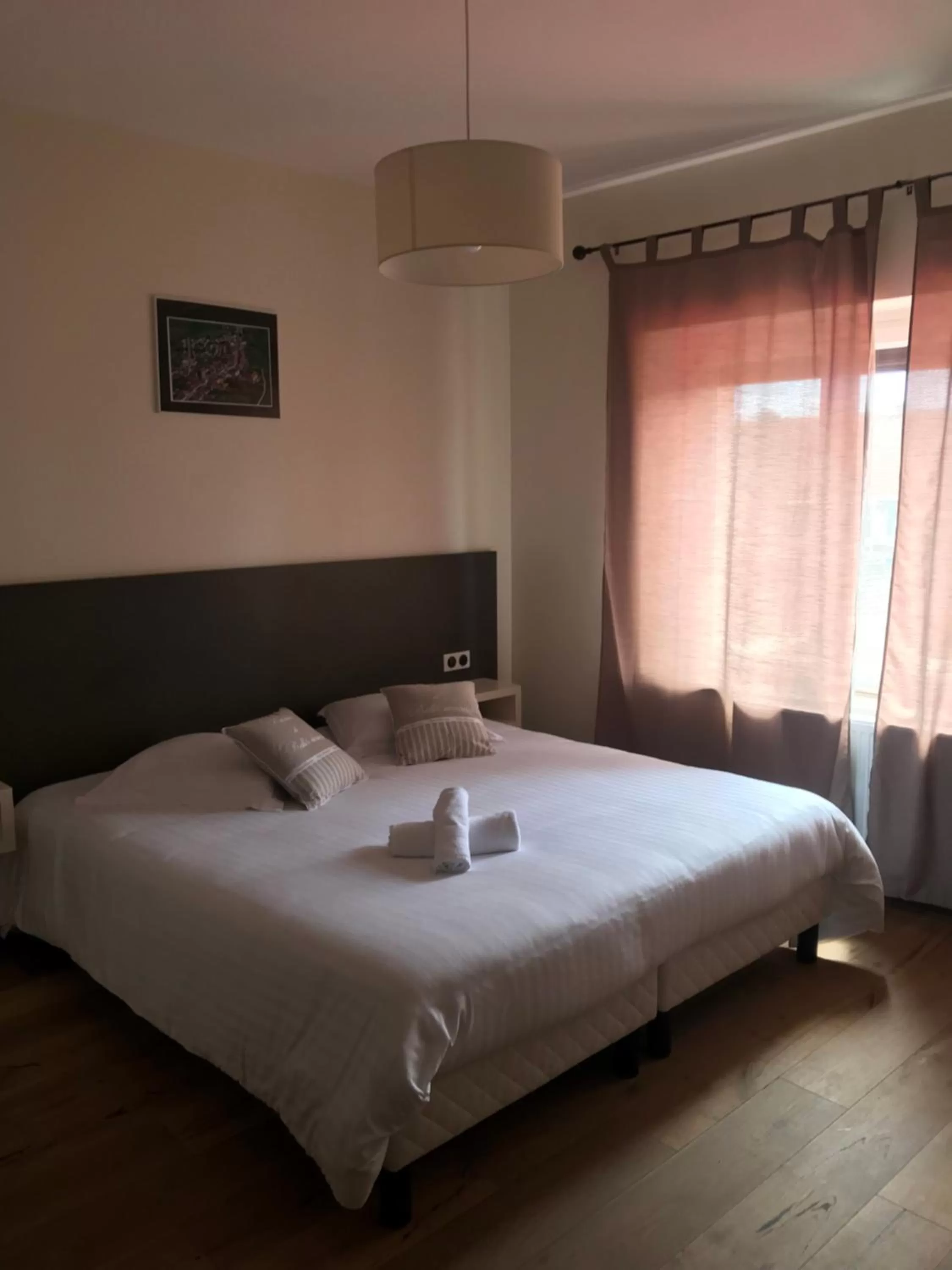 Bed in Logis Le Provençal