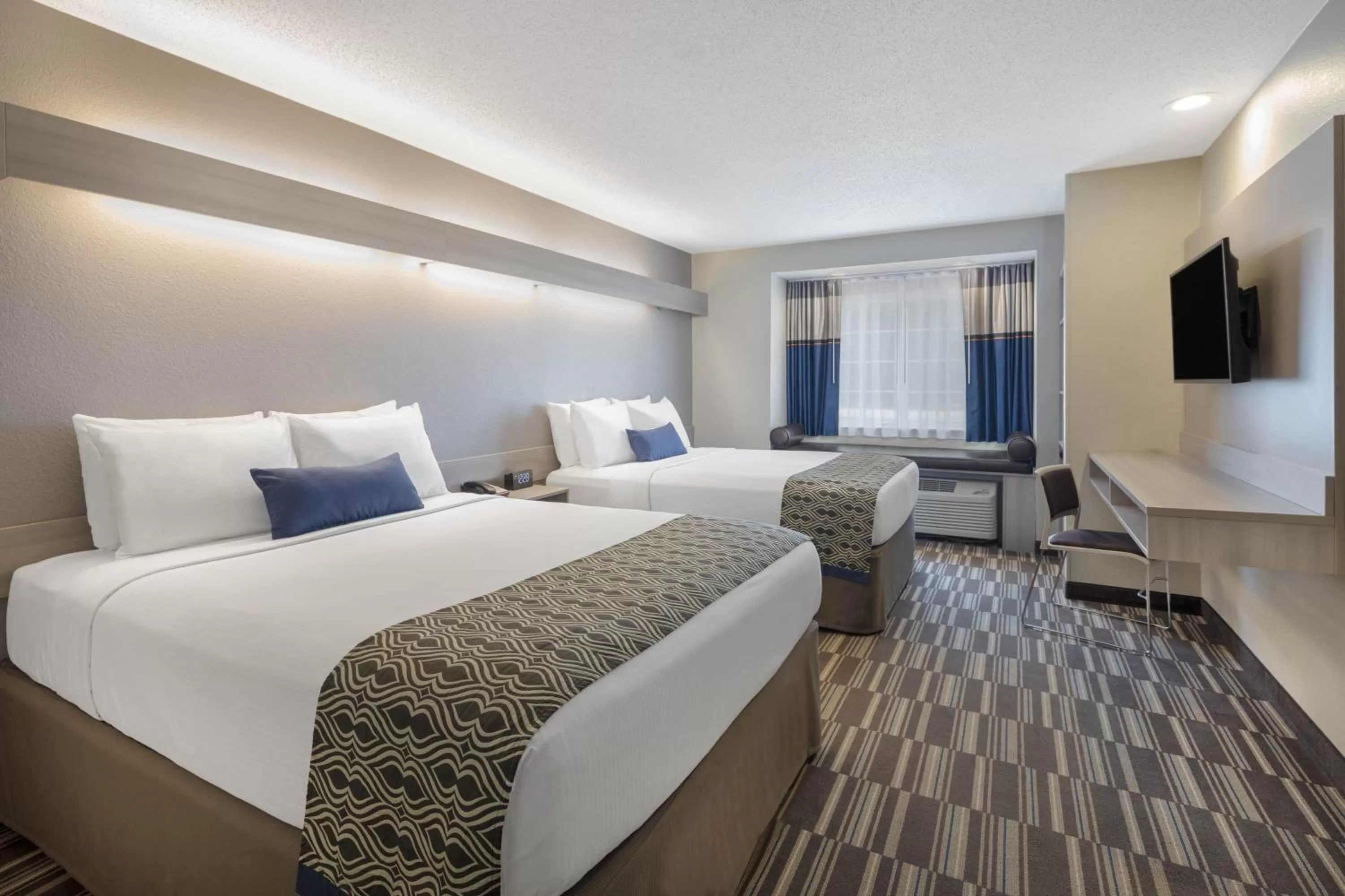 Bed in Microtel Inn & Suites by Wyndham Atlanta Buckhead Area
