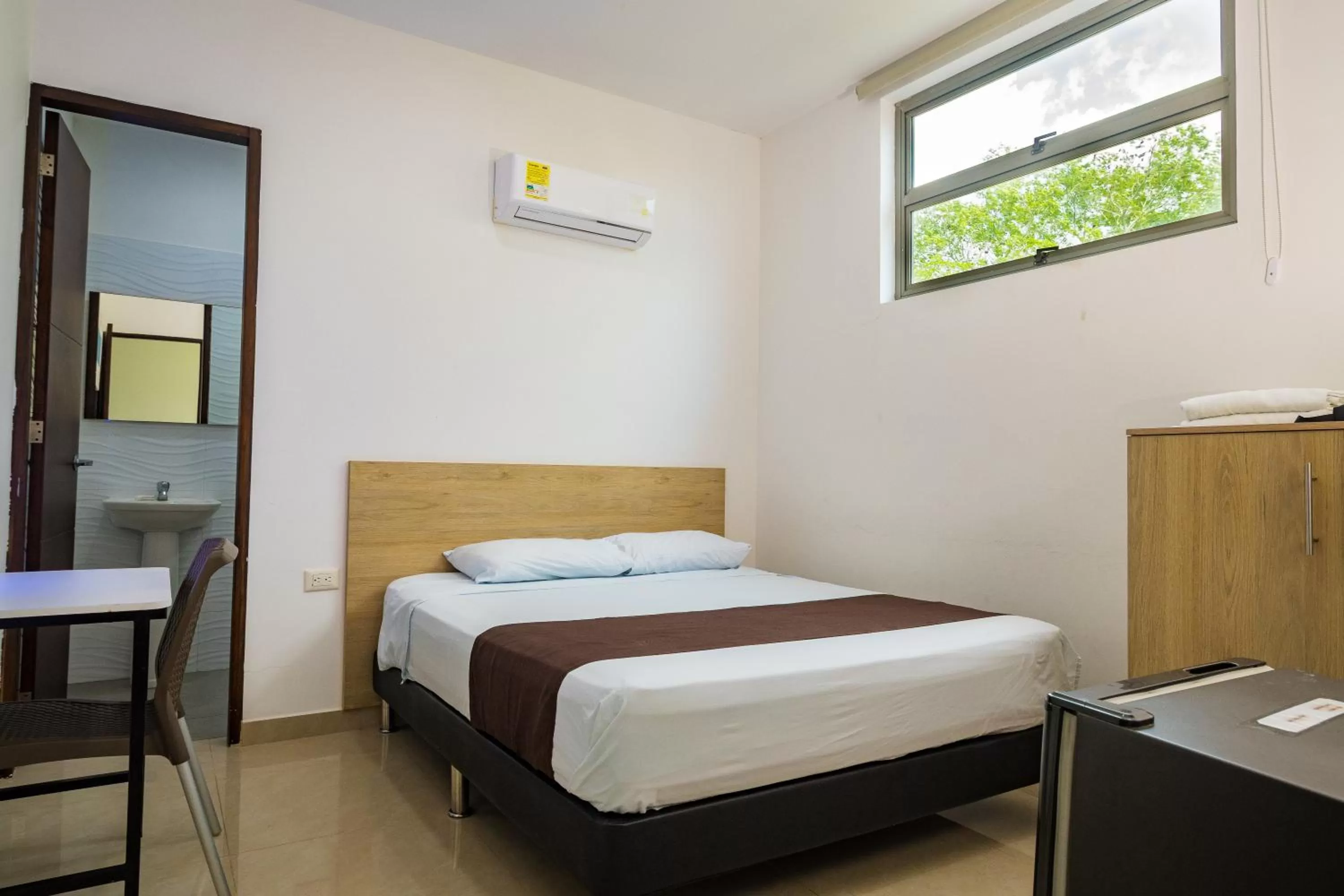 Bed in Genesis Hotel