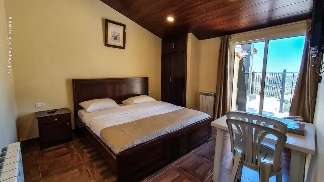 Bed in Hotel L'Aiglon