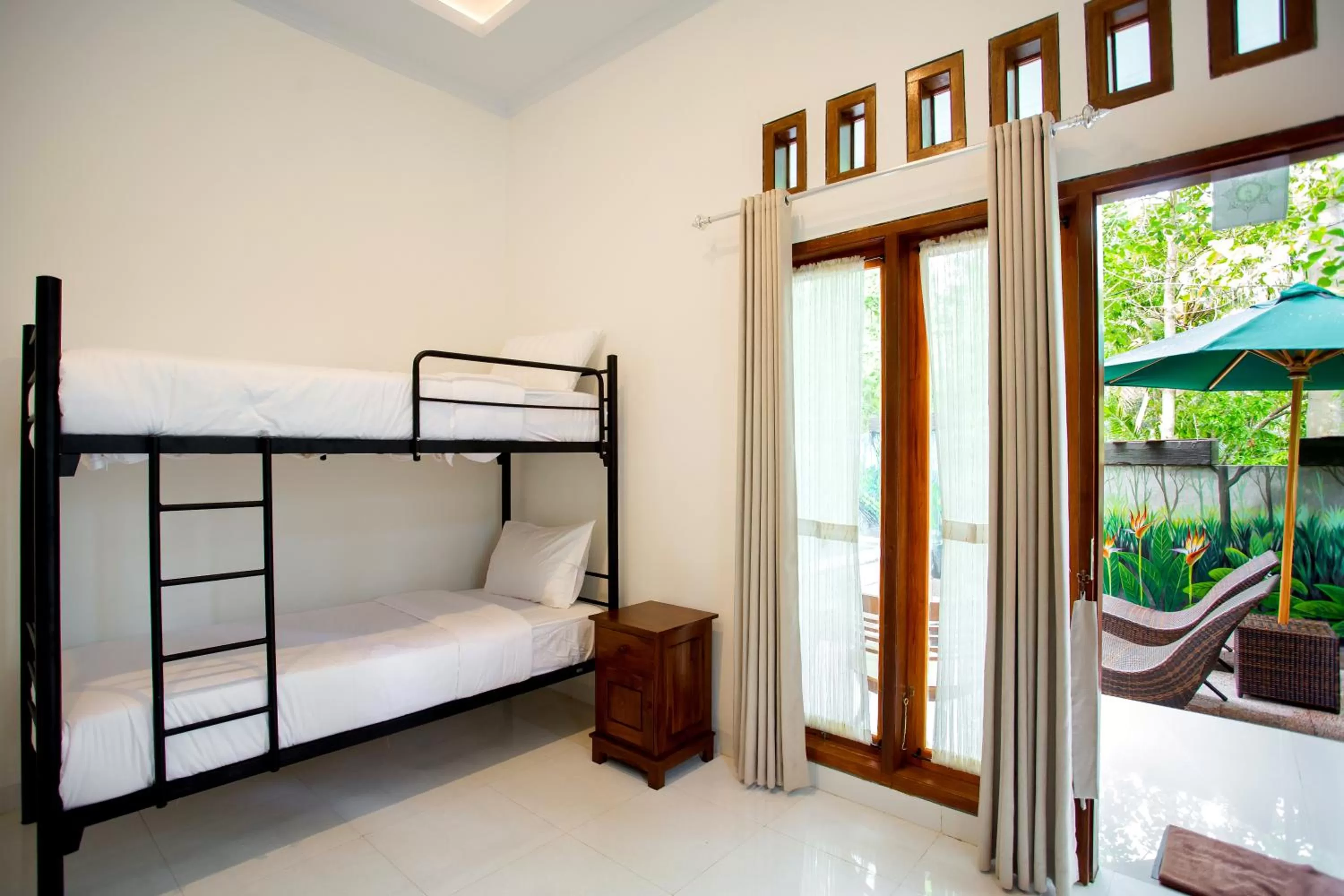 Decorative detail, Bed in The Puncak Santhi Inn