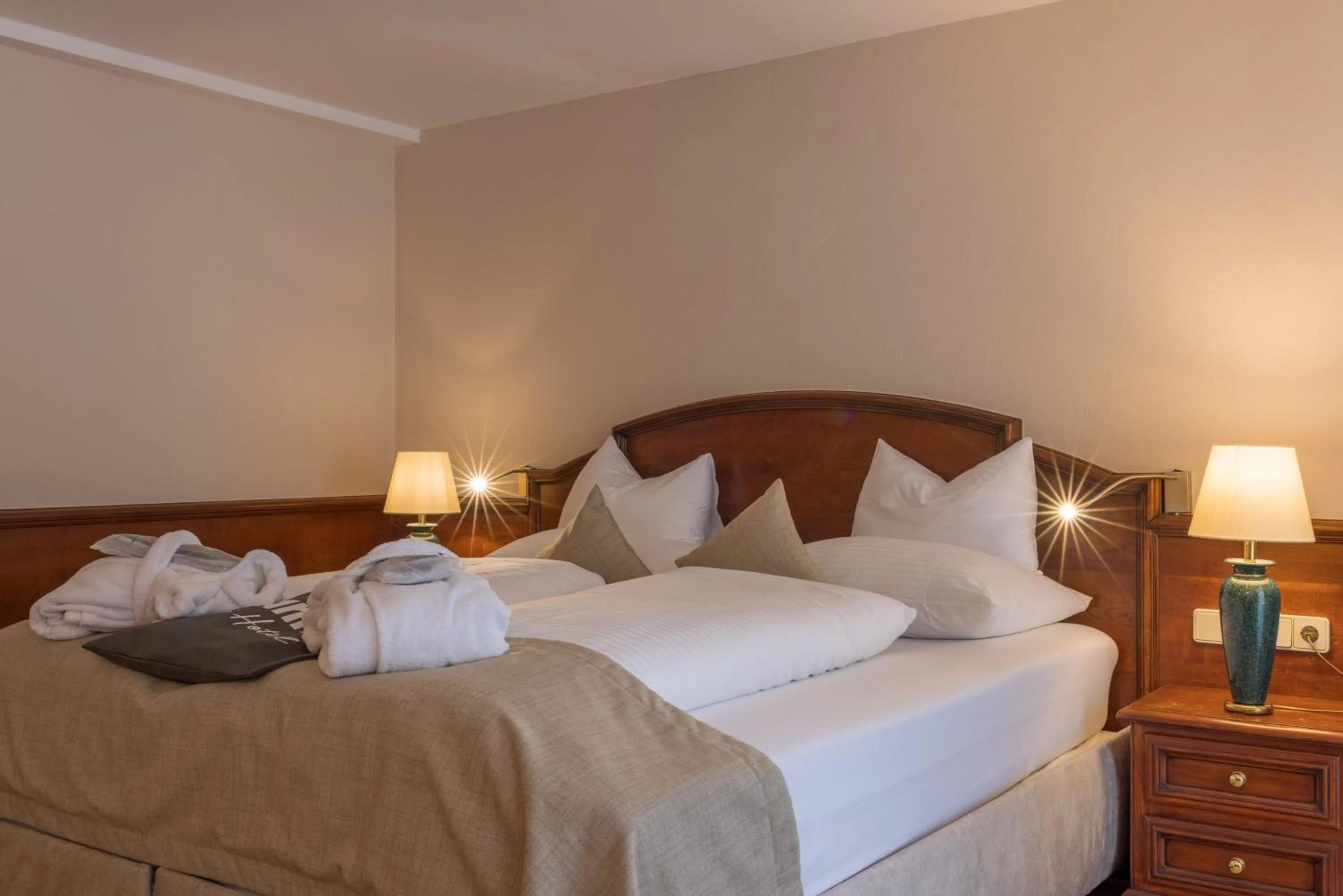 Bed in MANNI das Hotel