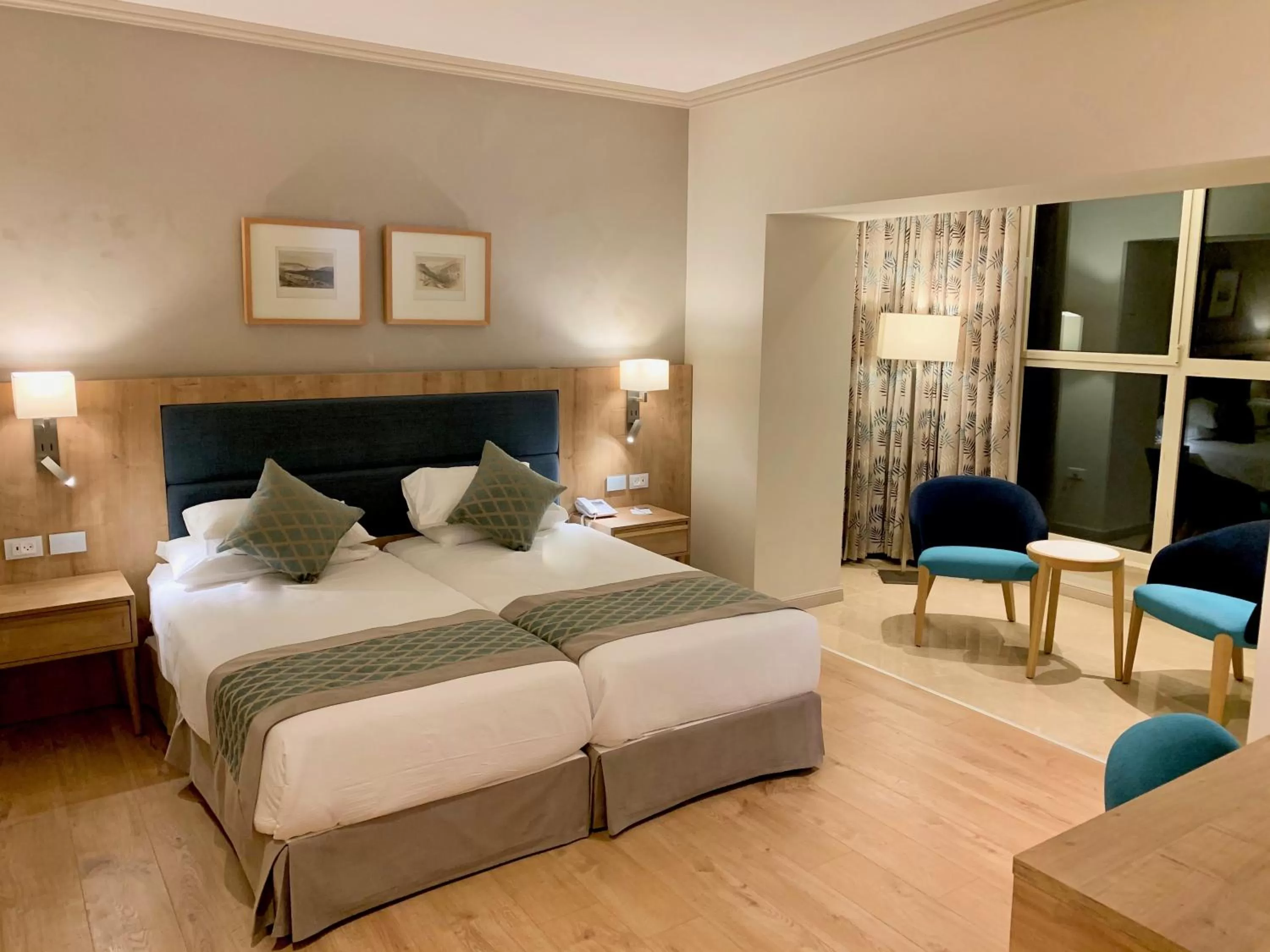 Bed in Ambassador Boutique Hotel