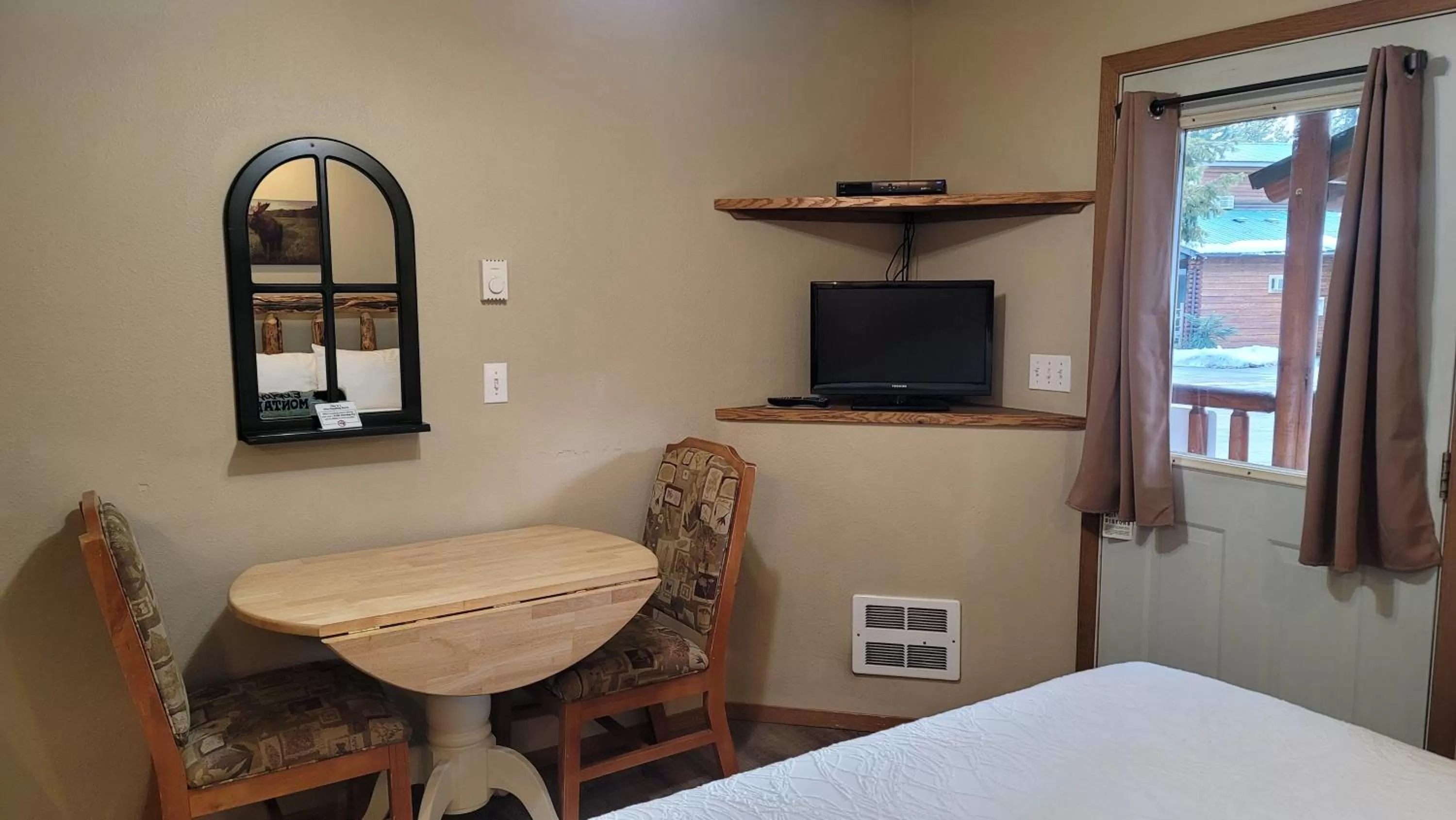 Bed in Riverfront Motel & Cabins