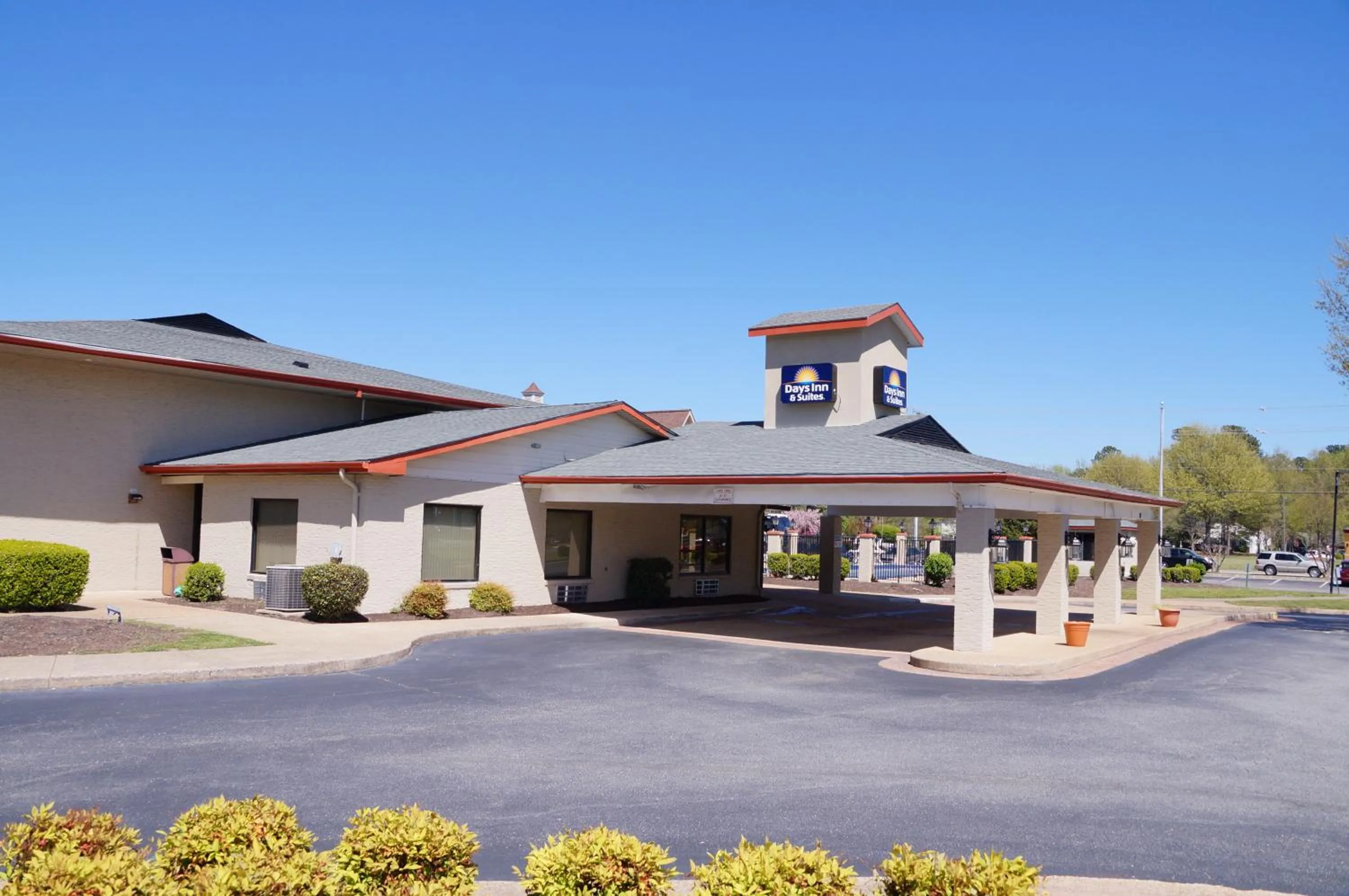 Property building in Days Inn & Suites by Wyndham Colonial