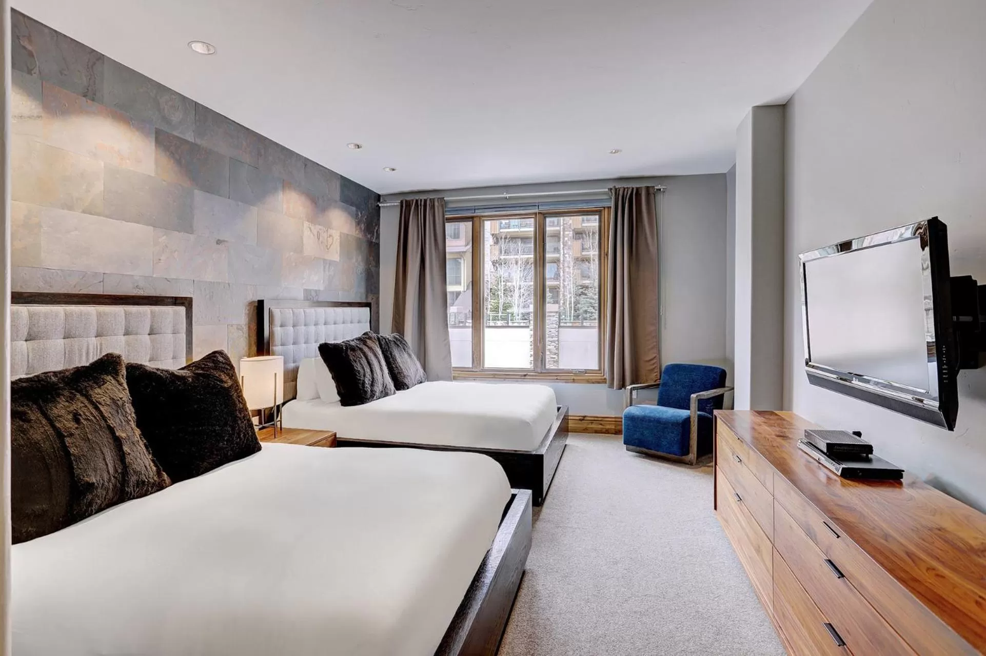 Bed in The Arrabelle at Vail Square, a RockResort, by Vail Resorts