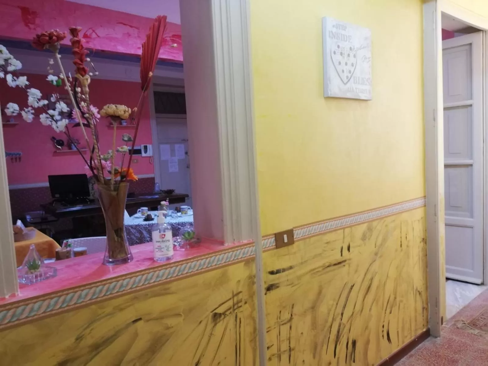 Communal lounge/ TV room in B&B Orchidea