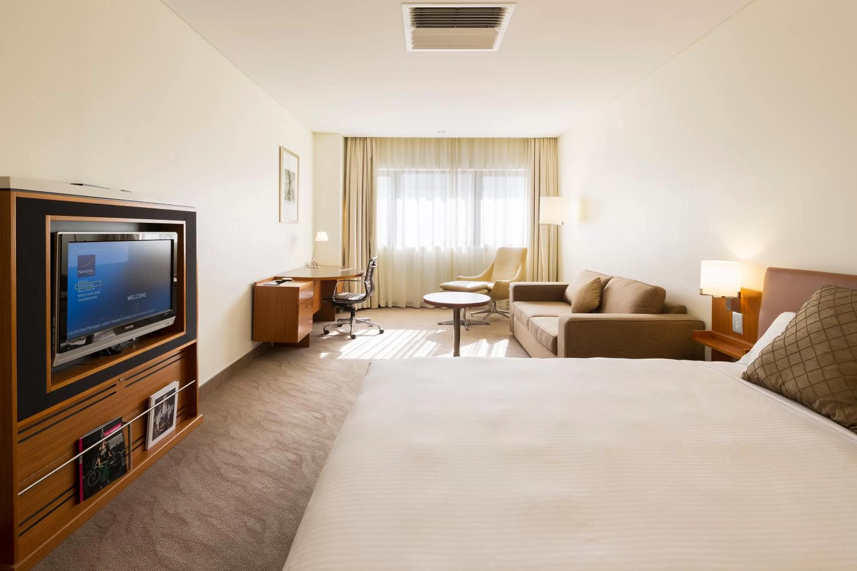 Photo of the whole room, Bed in Novotel Canberra