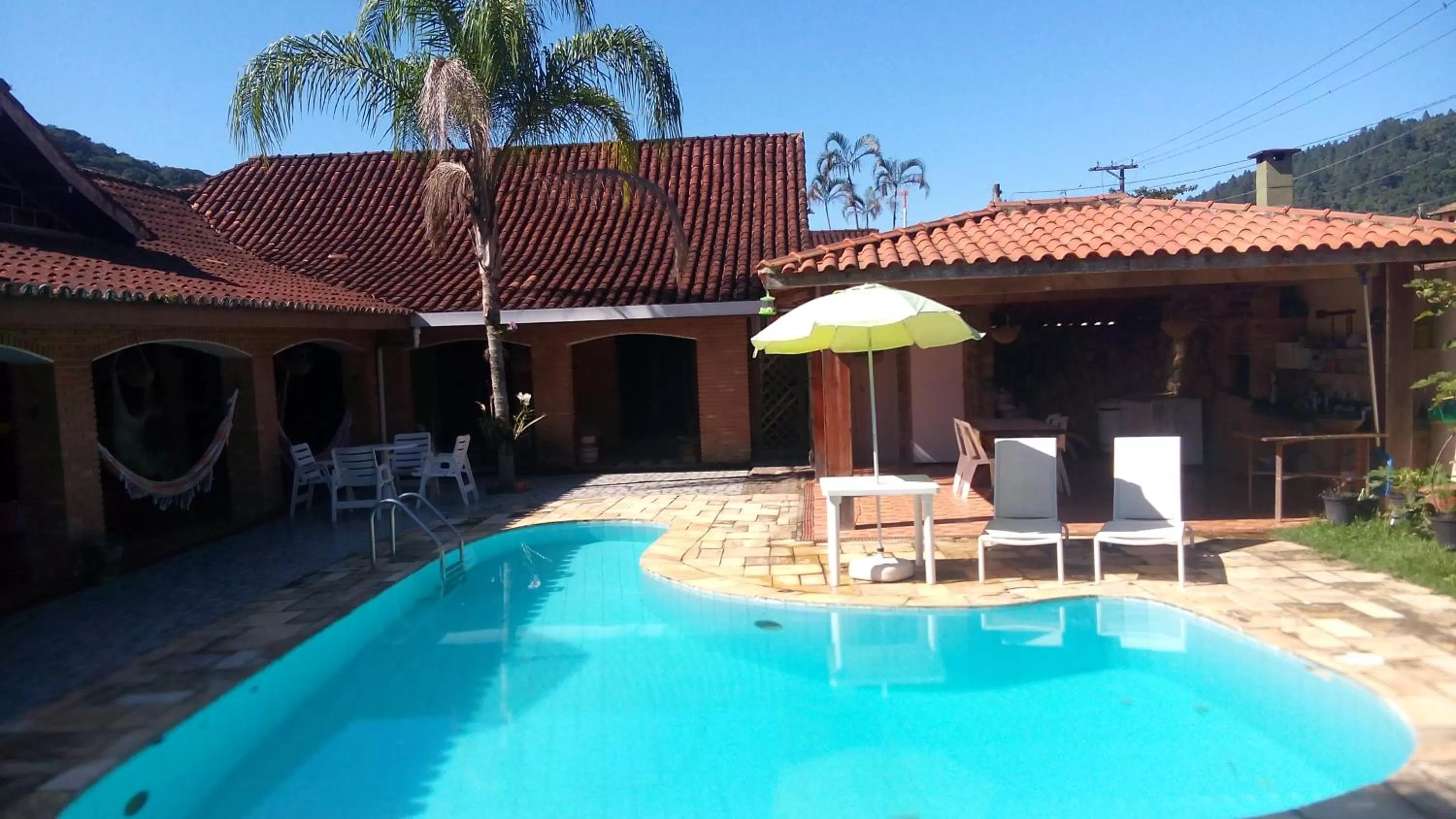 Swimming pool in Pousada Na Praia Ubatuba