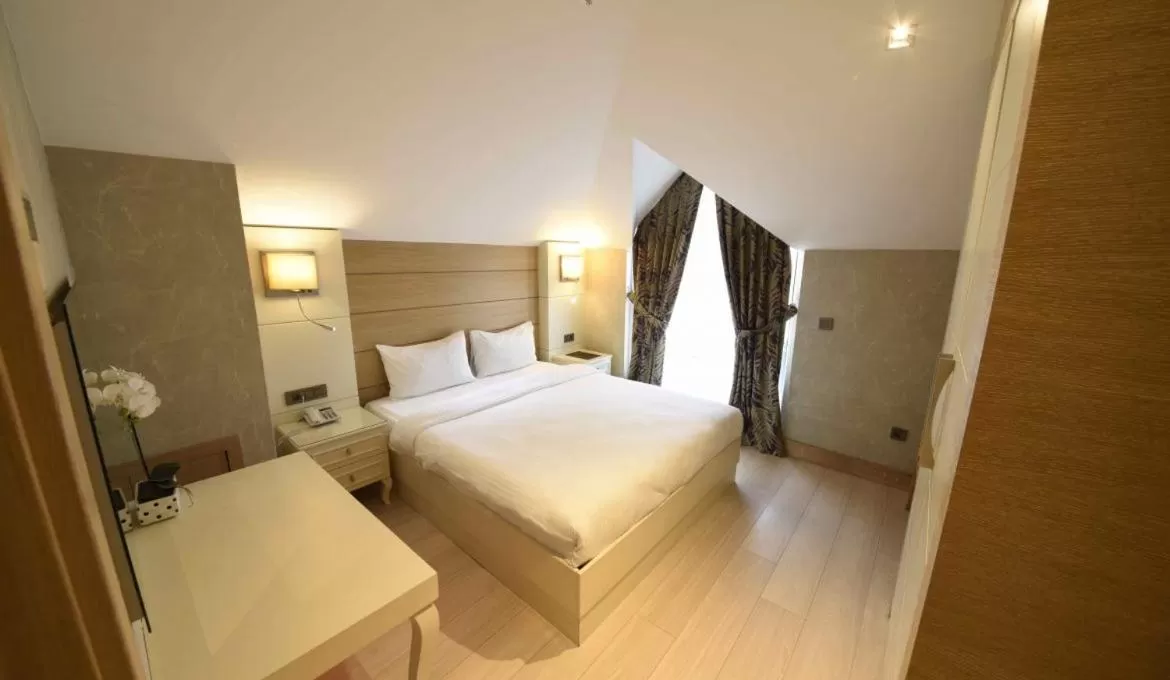 Bed in Hotel Le Mirage