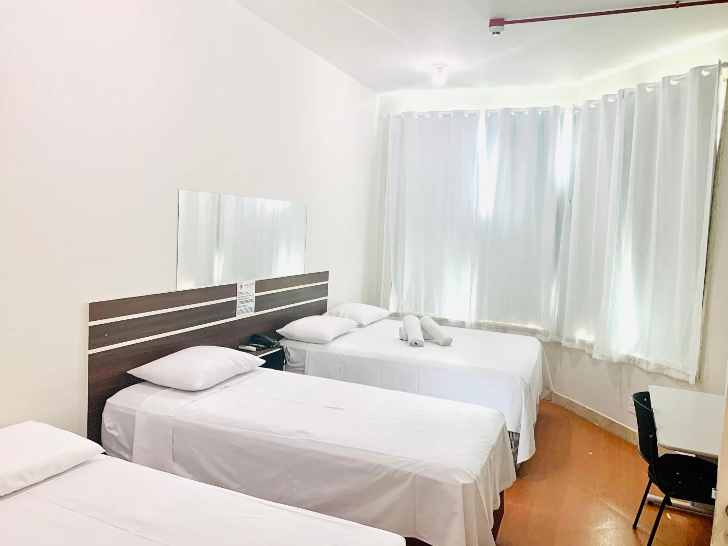 Bed in SAMIR HOTEL COMFORT