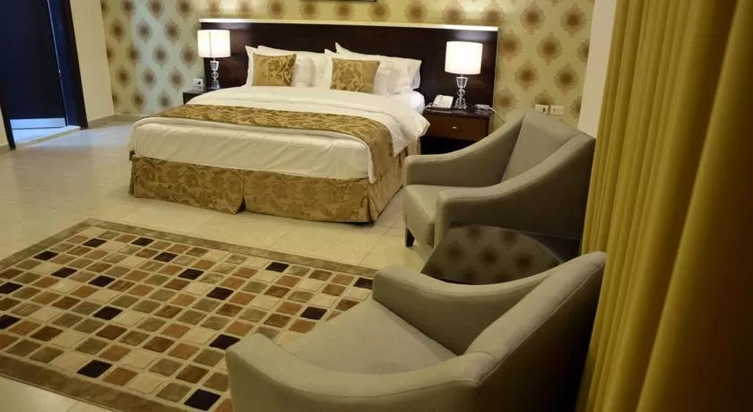 Bed in City Rose Hotel Suites