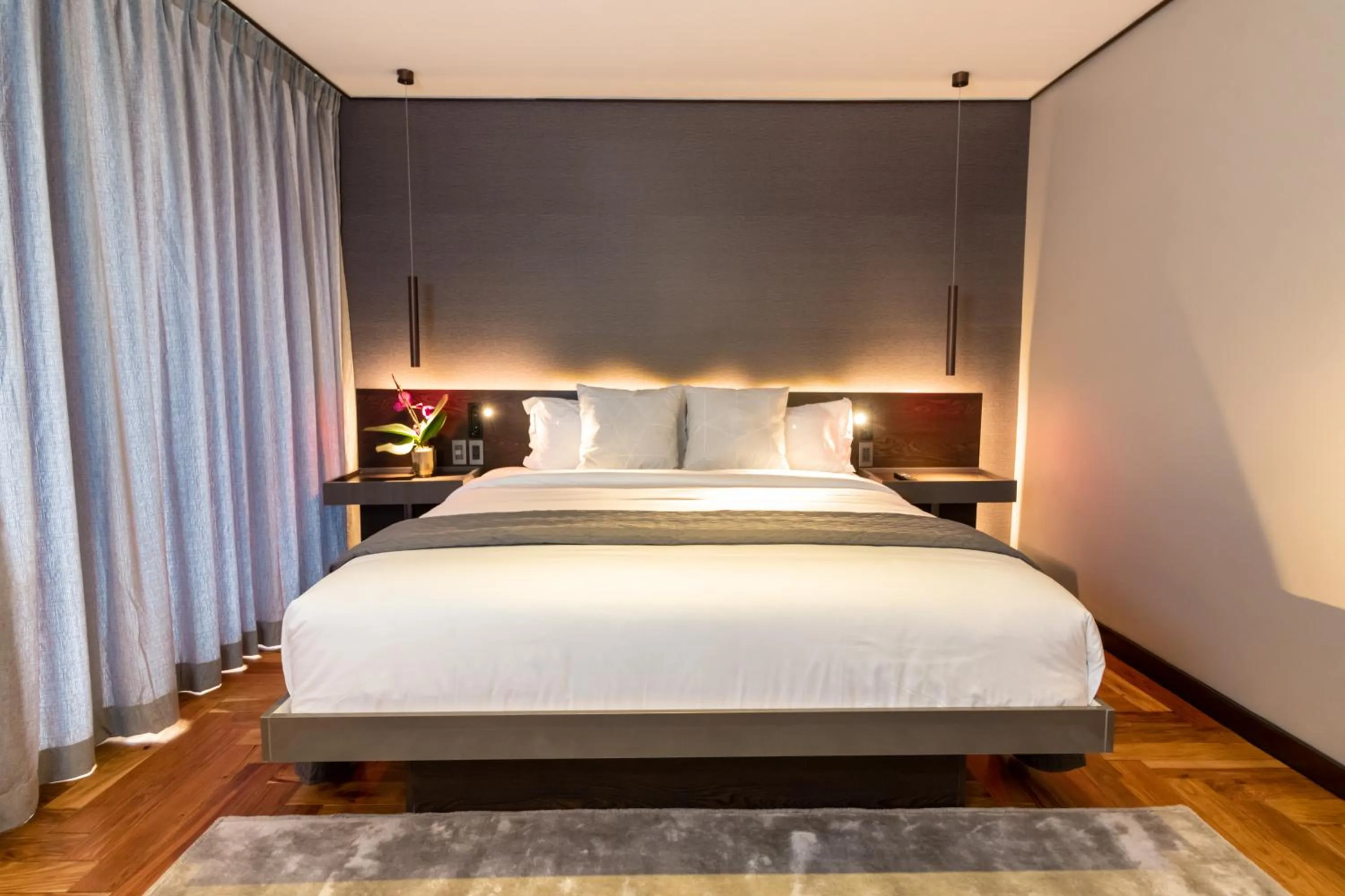 Bed in Ramada Encore by Wyndham Makati