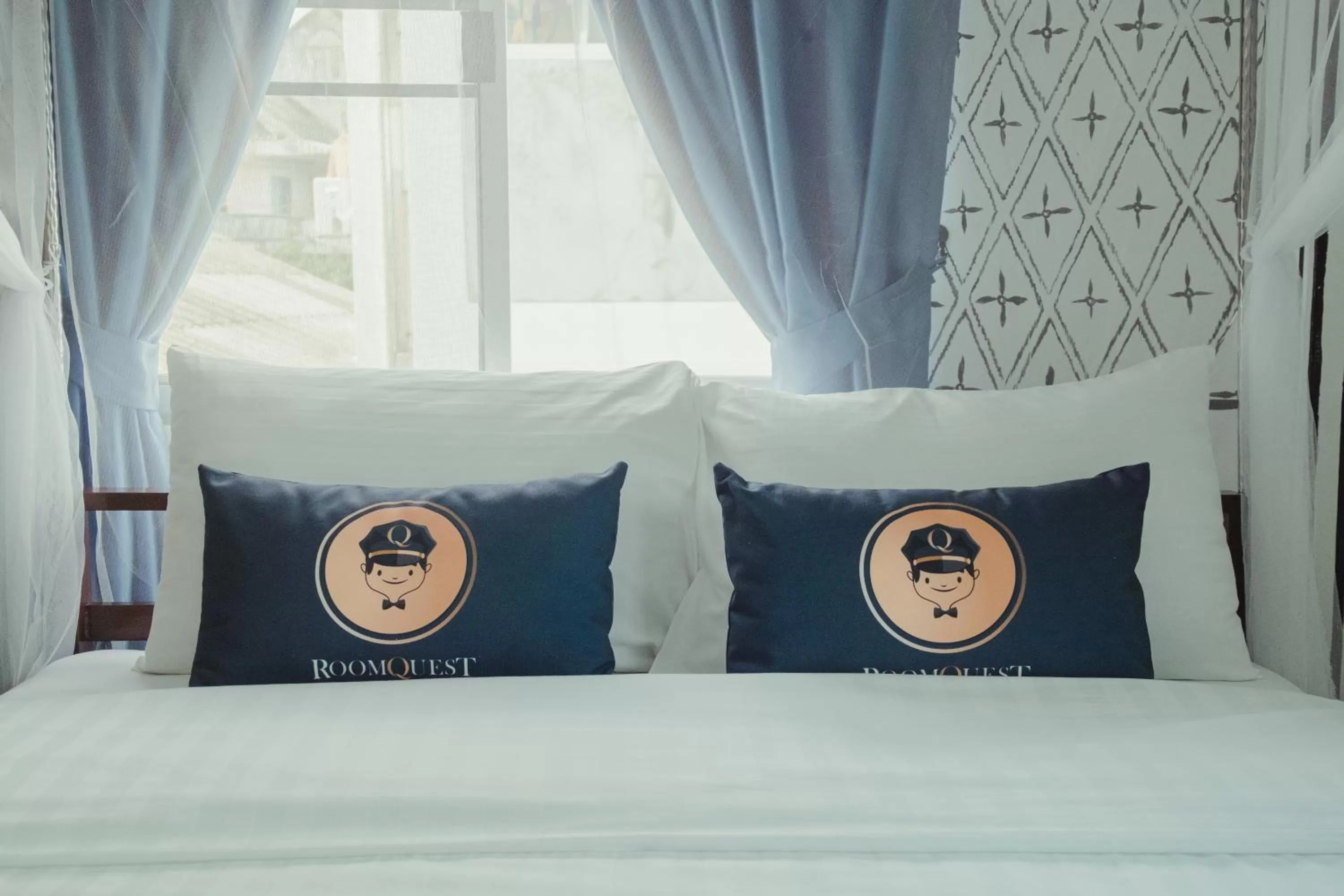 Bed in RoomQuest Chiang Mai Tha Phae