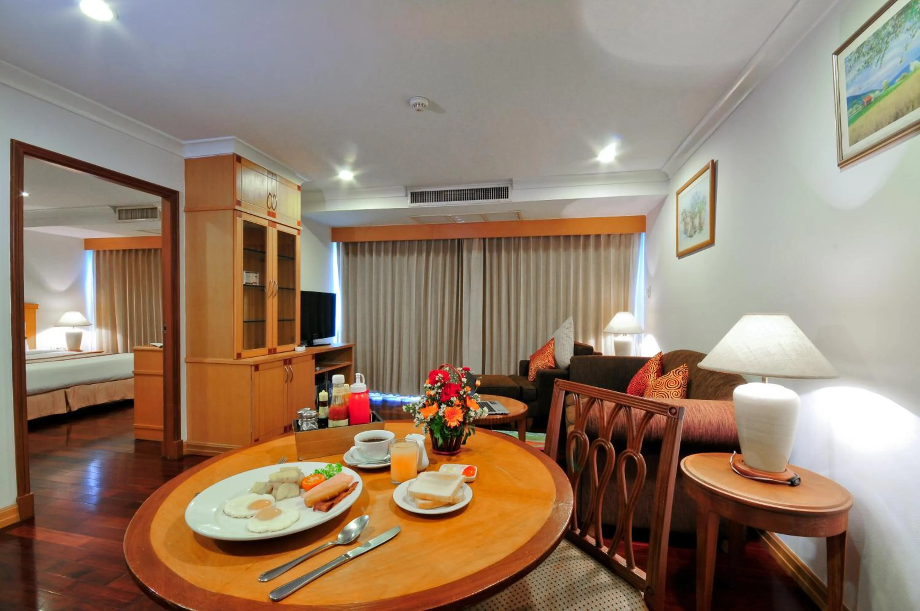 Living room, Bed in Admiral Suites Bangkok