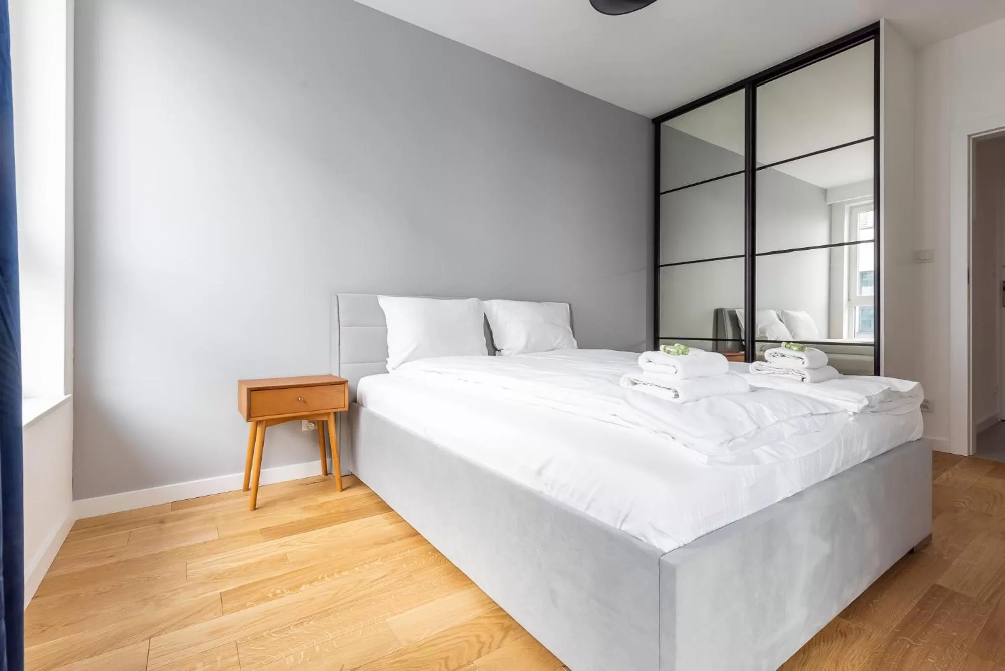 Bed in Symphony Modern Tower Apartamenty