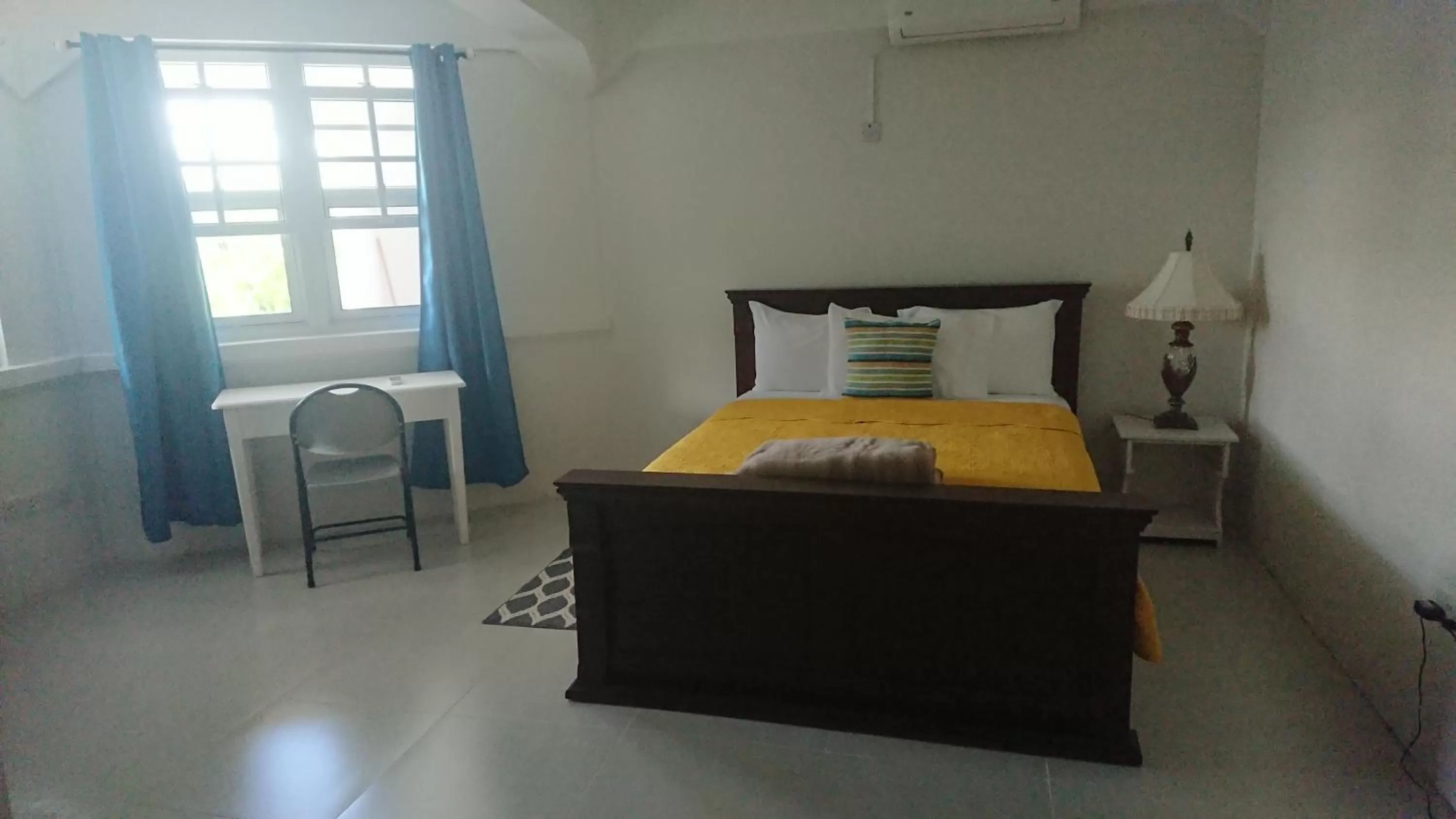 Bed in Classique International in Dominica