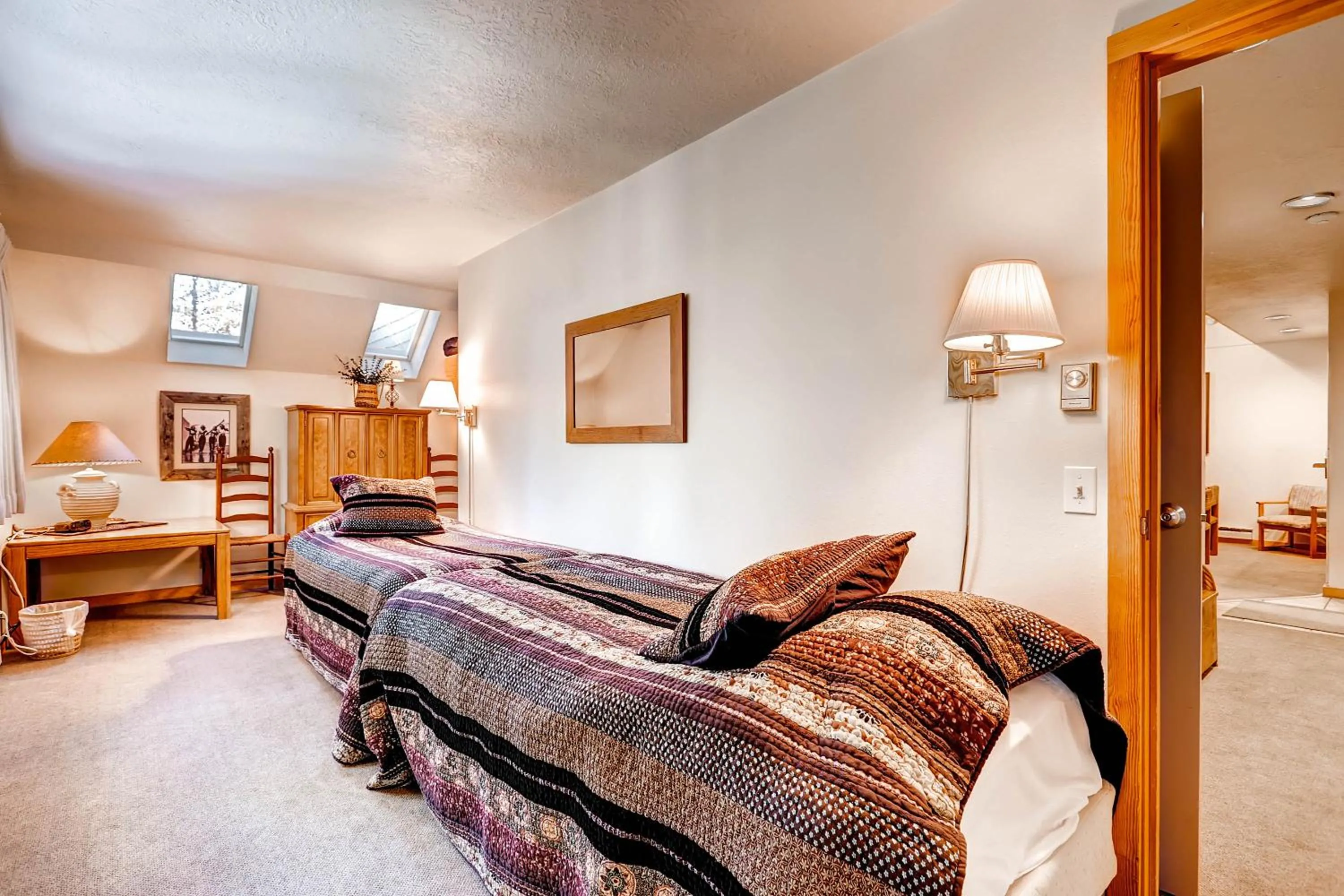 Bed in Evergreen Condominiums by Vail Resorts