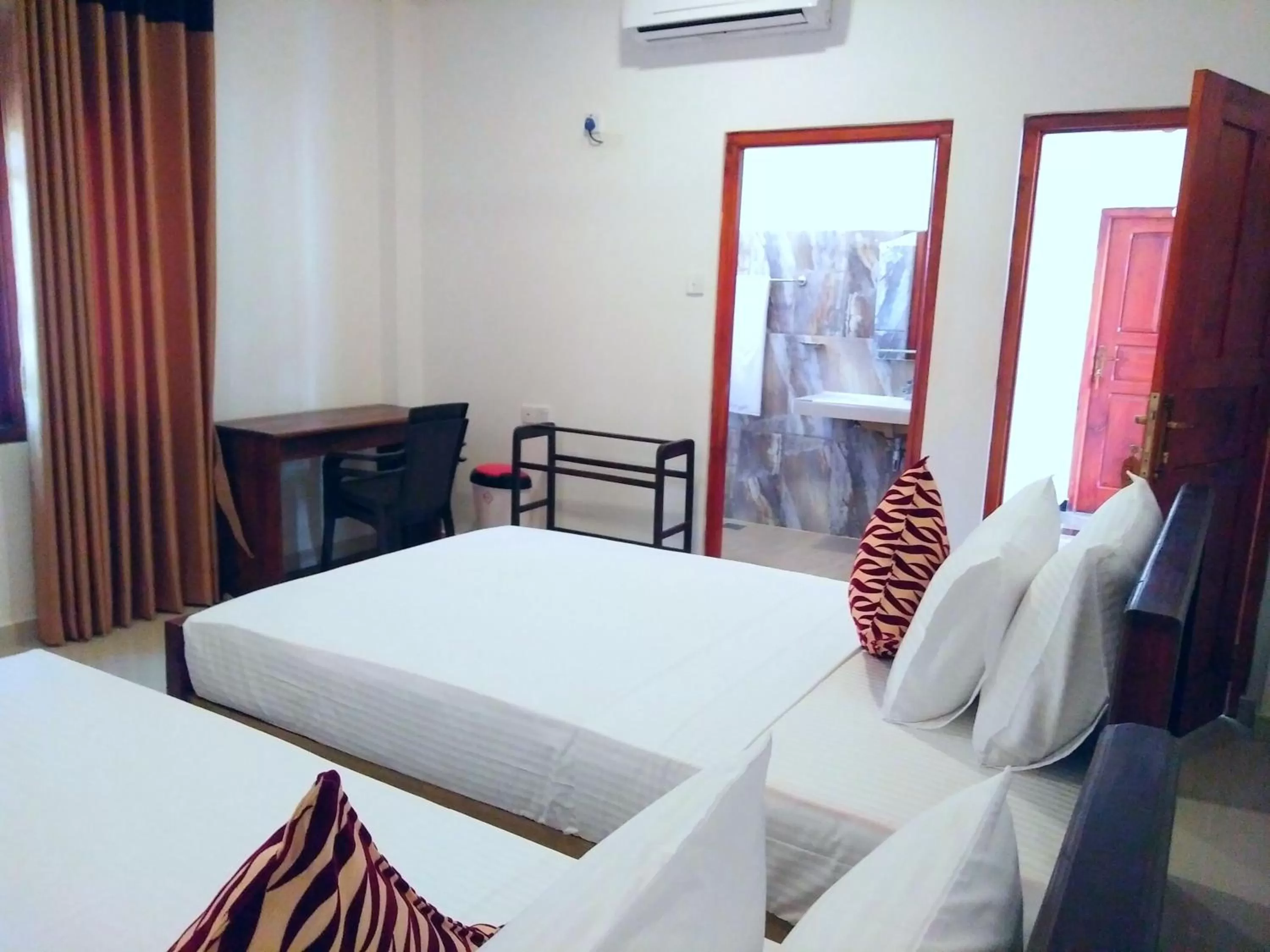 Bed in Ocean Bay Surf Resort Weligama