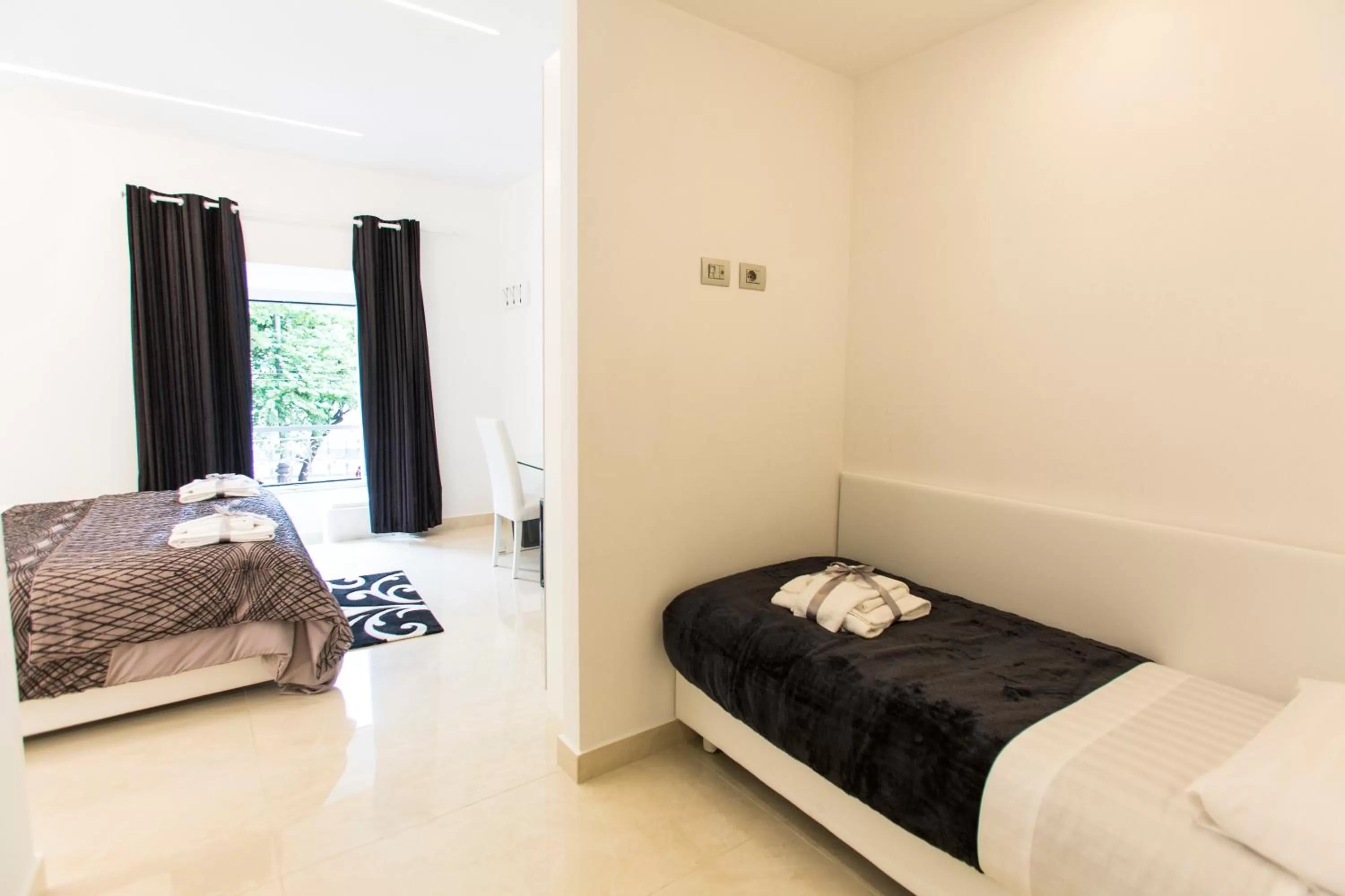 Bed in San Pietro Grand Suite