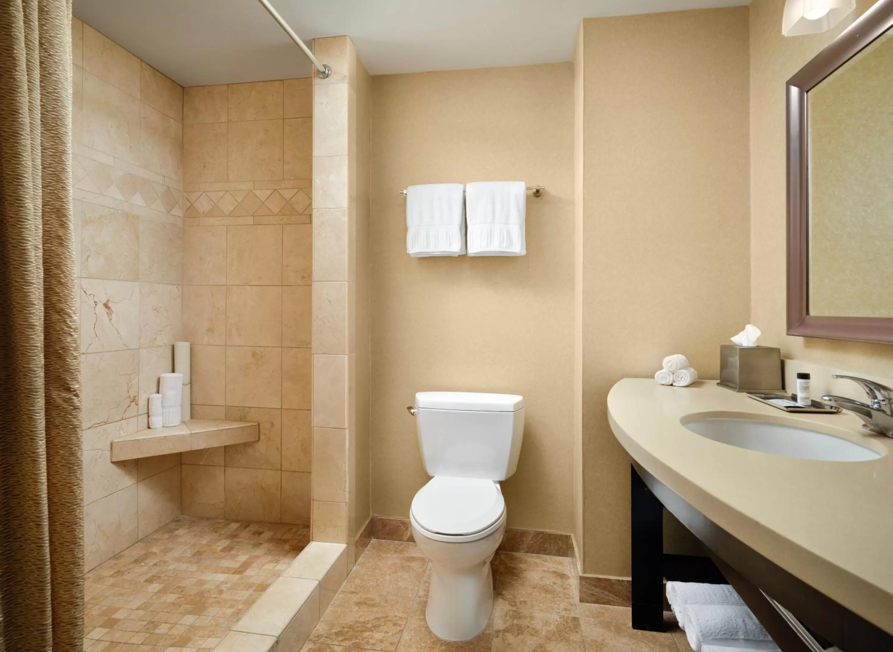 Bathroom in West Inn & Suites