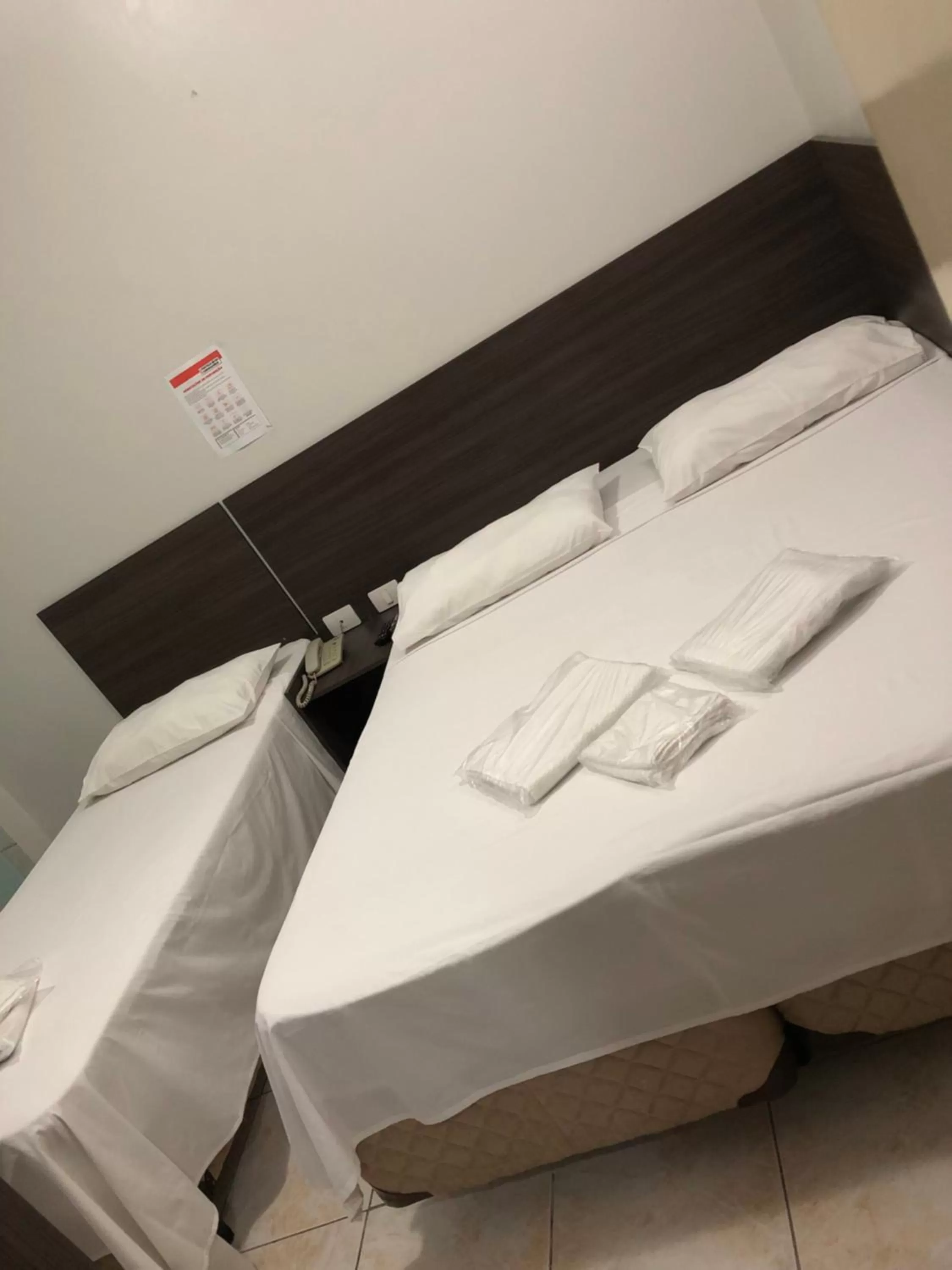 Bed in Center Plaza Hotel