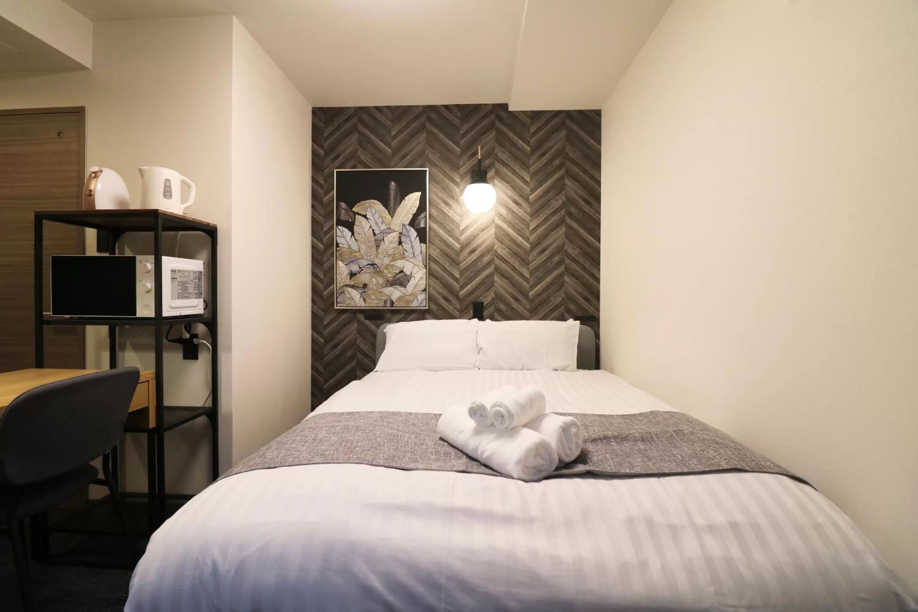 Bed in TAKETO STAY PREMIERE SAPPORO Eki