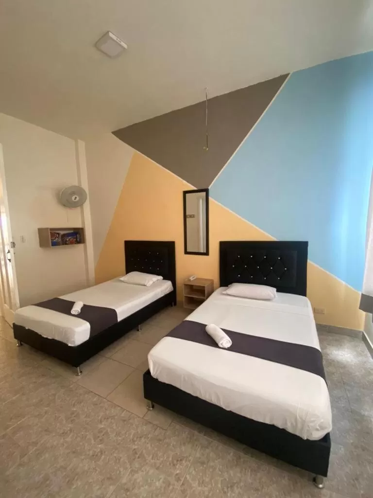 Bed in HOTEL CALLE REAL SUITE