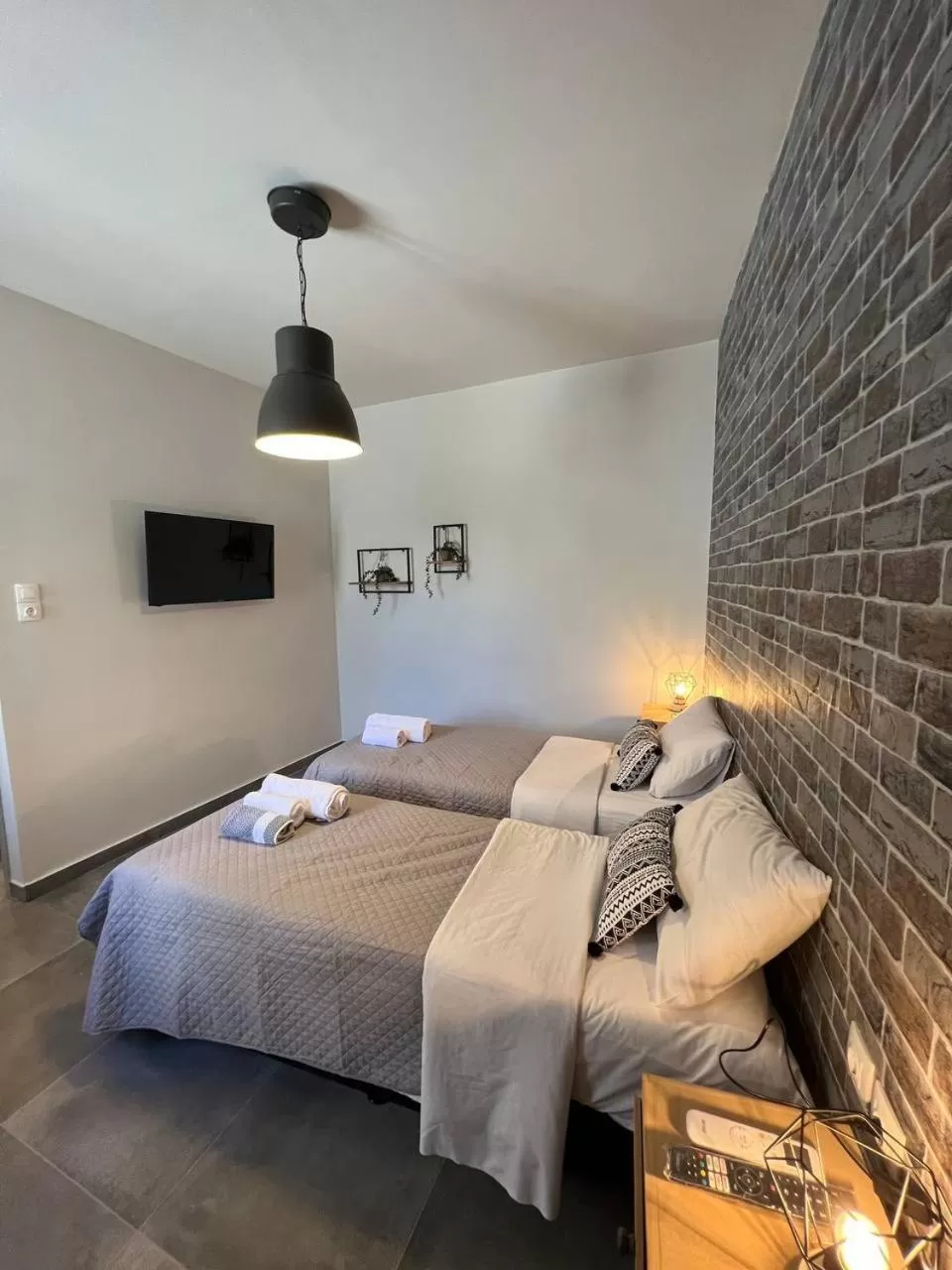 Bed in Elefsinian Mysteries Apartments