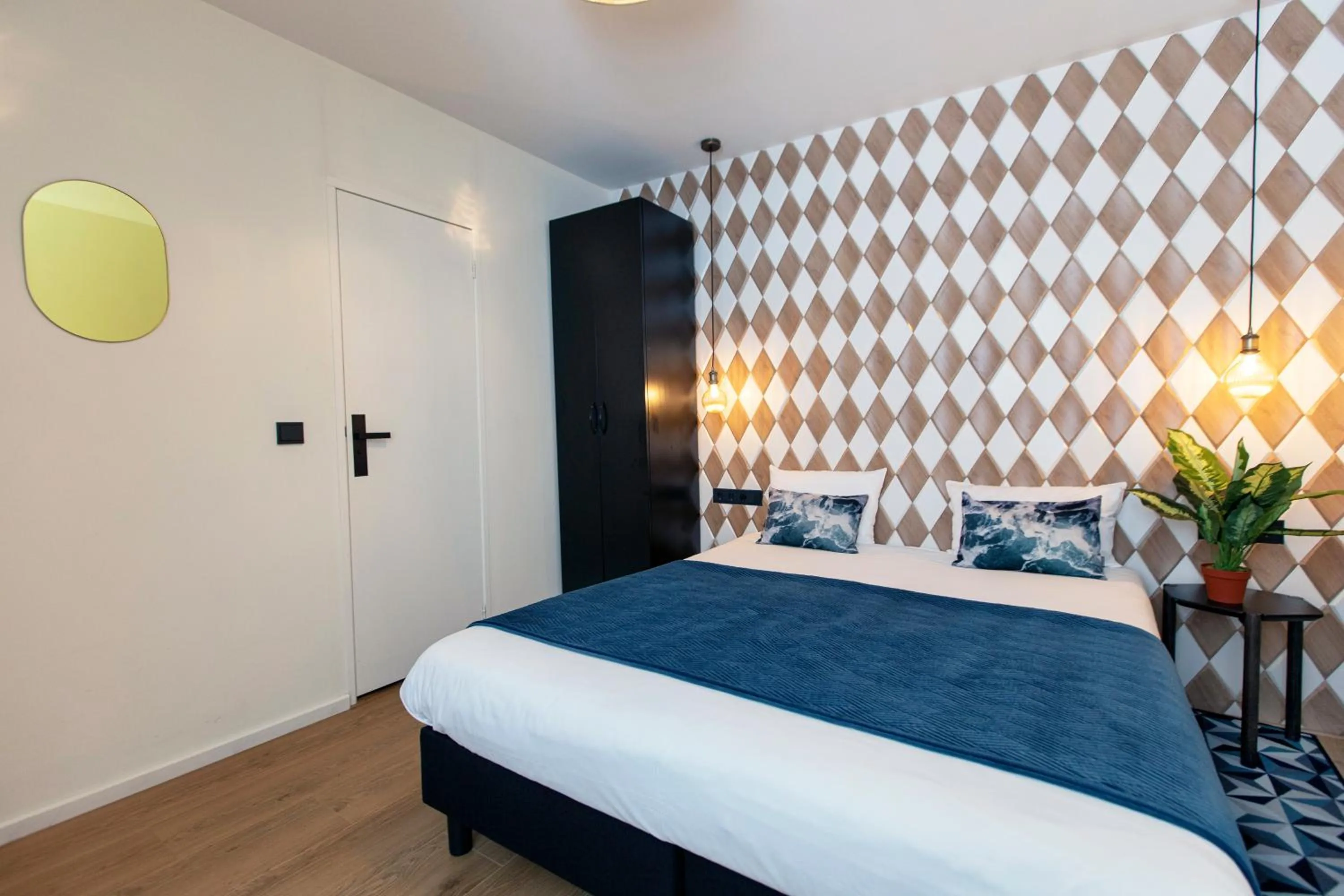 Bed in Quentin Golden Bear Hotel