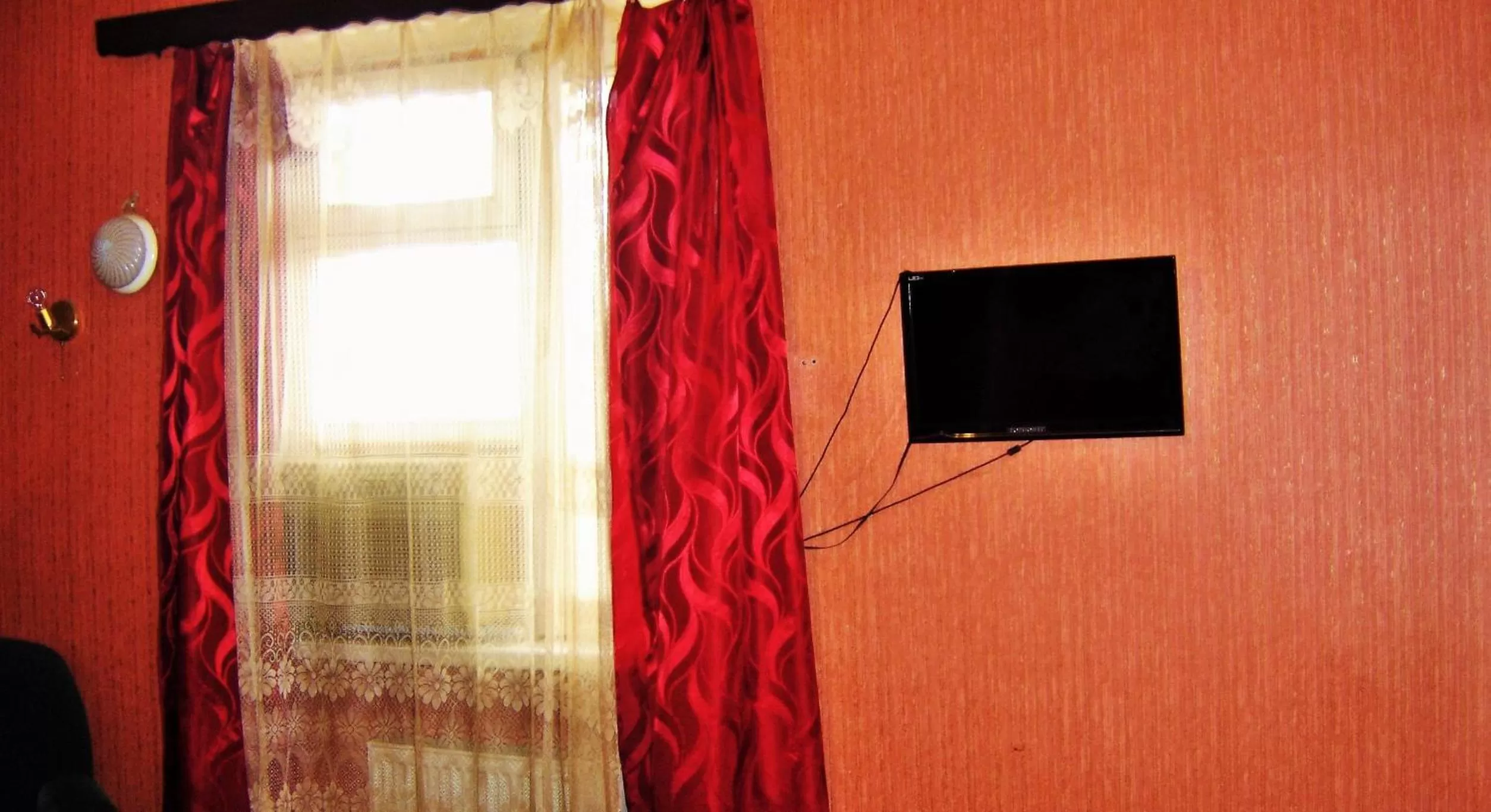 TV/Entertainment Center in Hotel Lilo near Airport