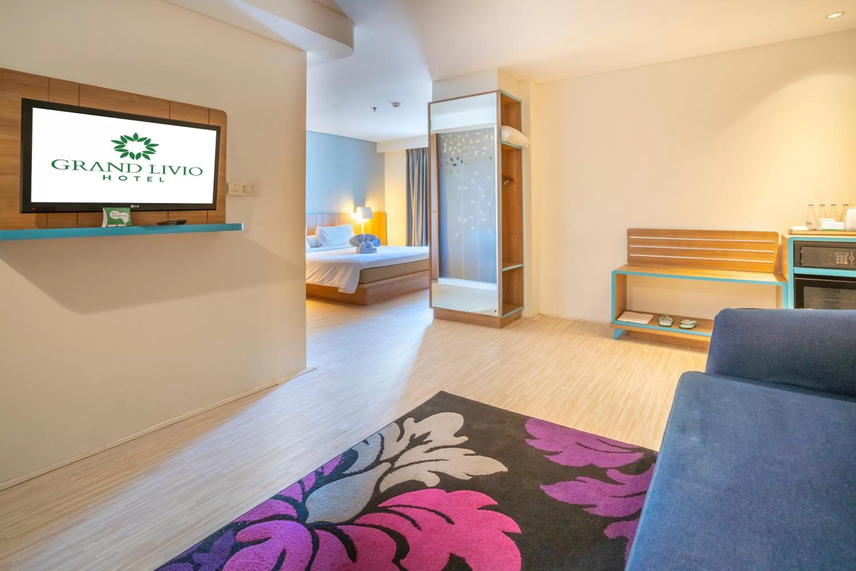 Living room, Bed in Grand Livio Kuta Hotel