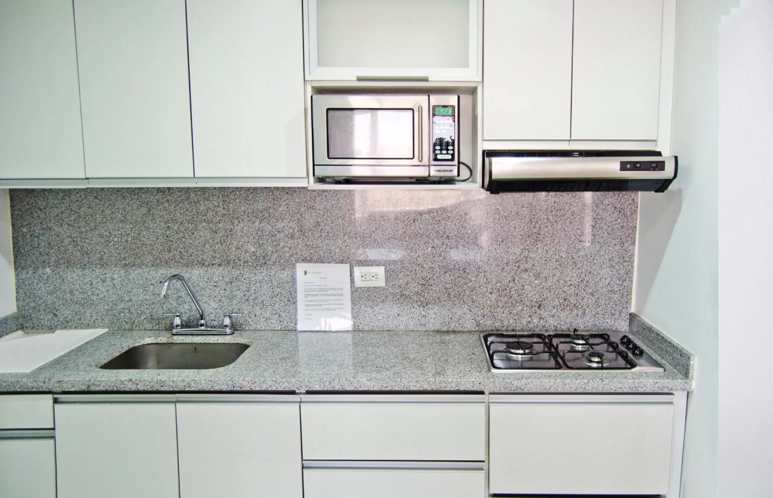 Kitchen or kitchenette in 122 Plaza Apartahotel