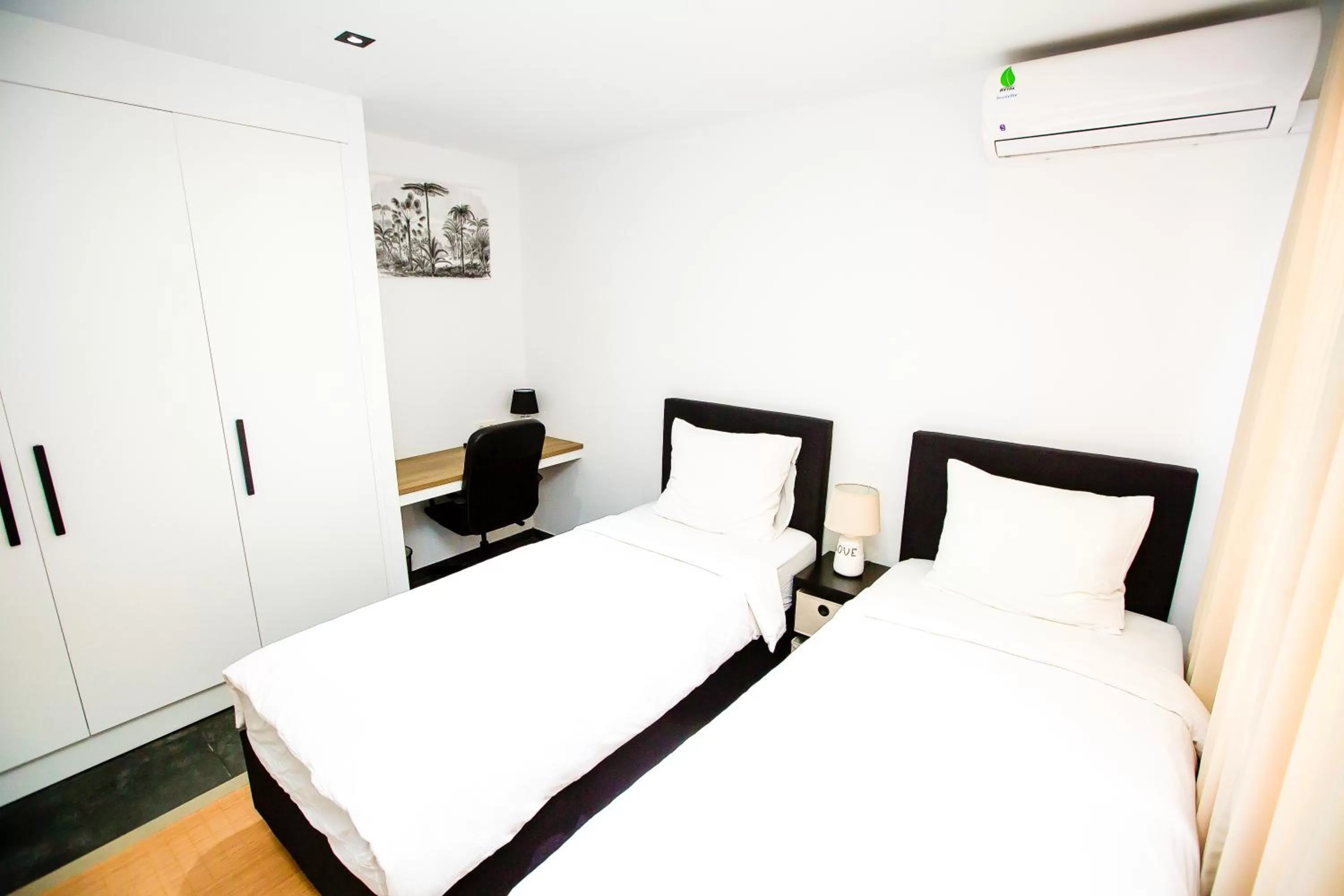 Bed in Bronbella Villa Residence