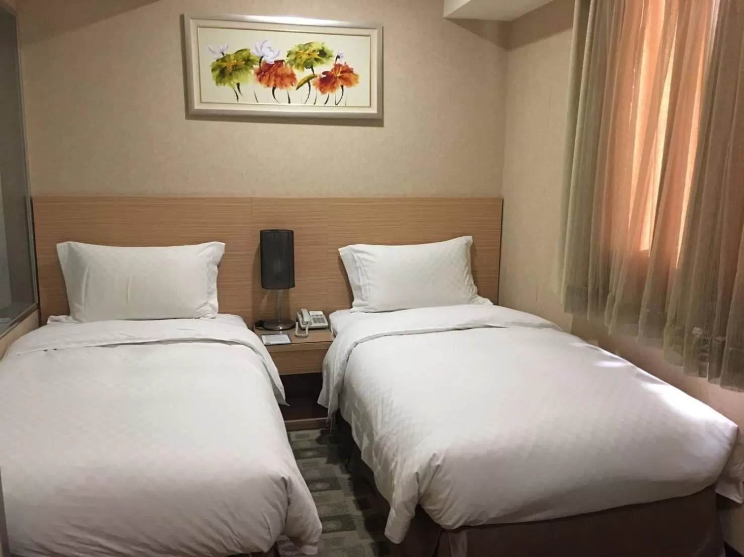 Bed in The Metro Hotel Taichung