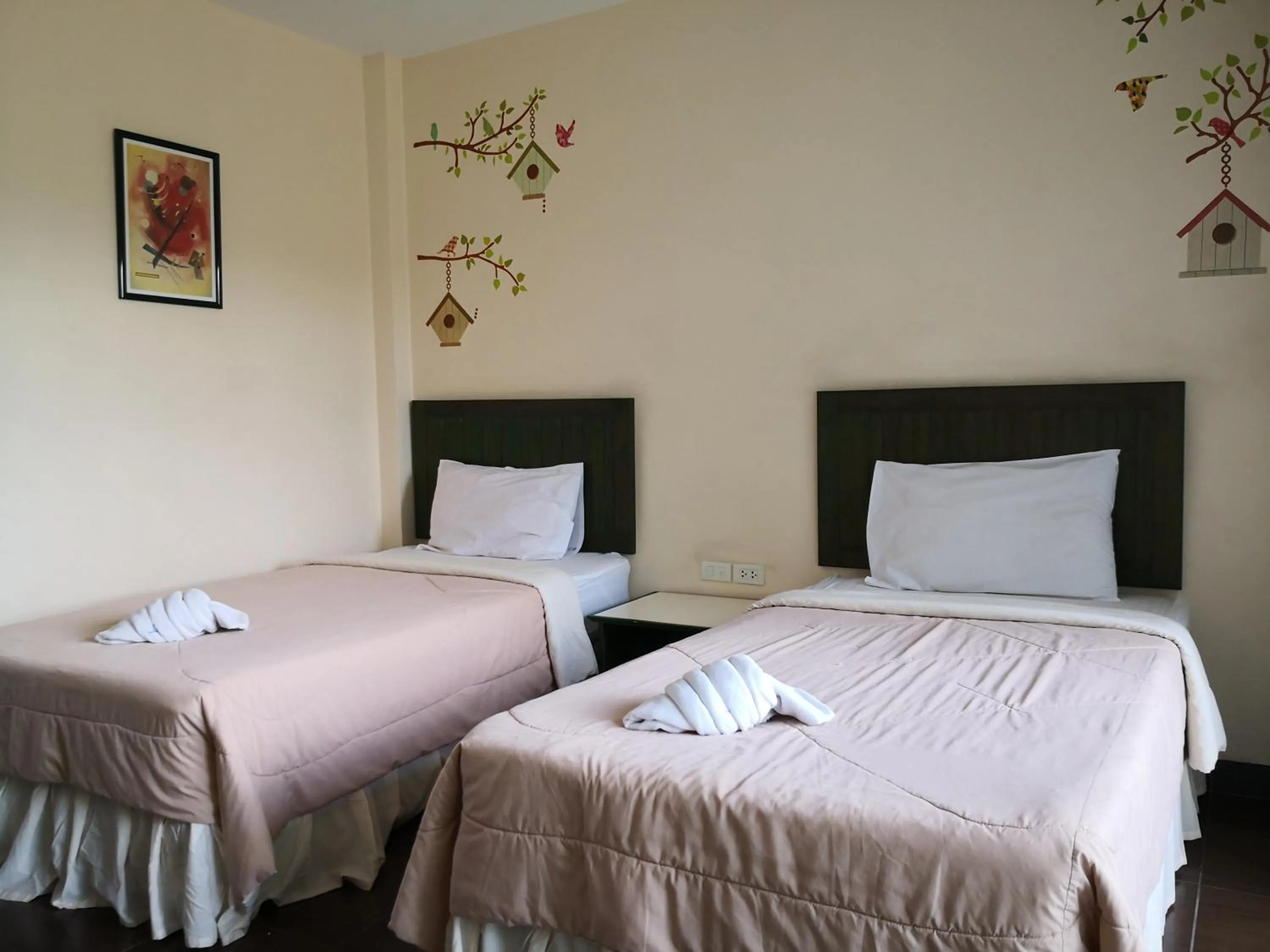 Bed in Baan Suksiri Hotel