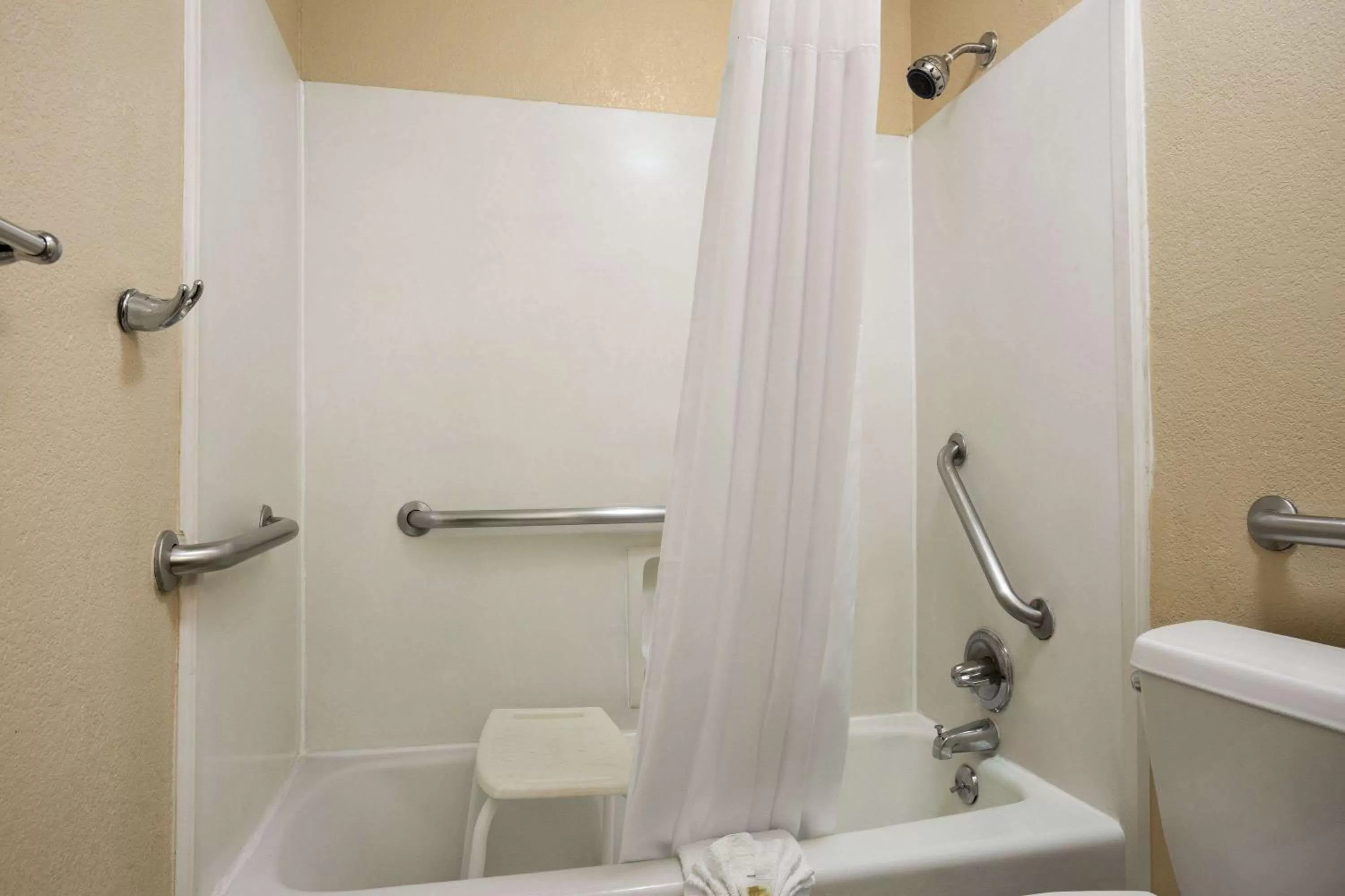 Bathroom in Days Inn by Wyndham Dallas Irving