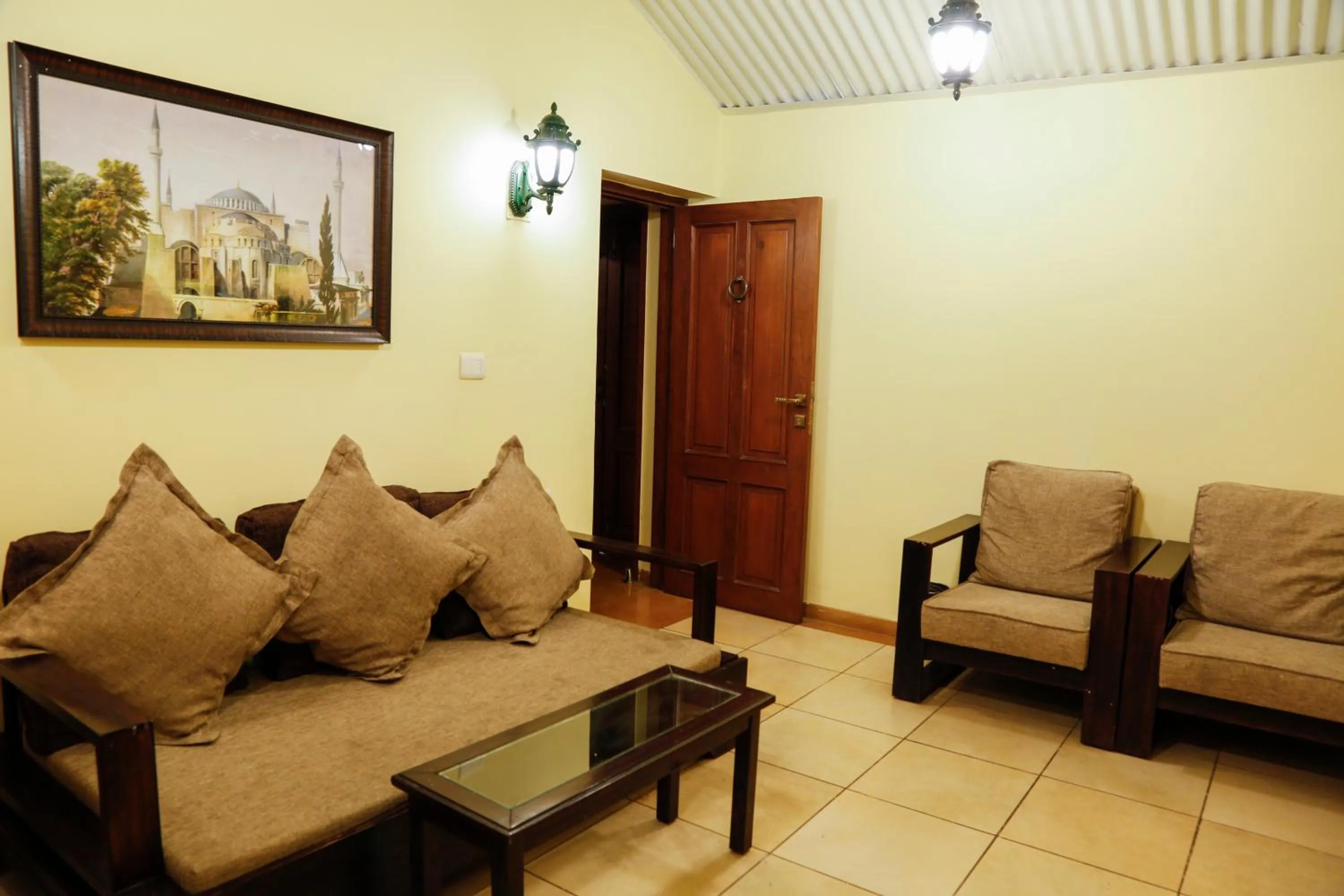 Seating area in The Colonial Manek Manor By SAH