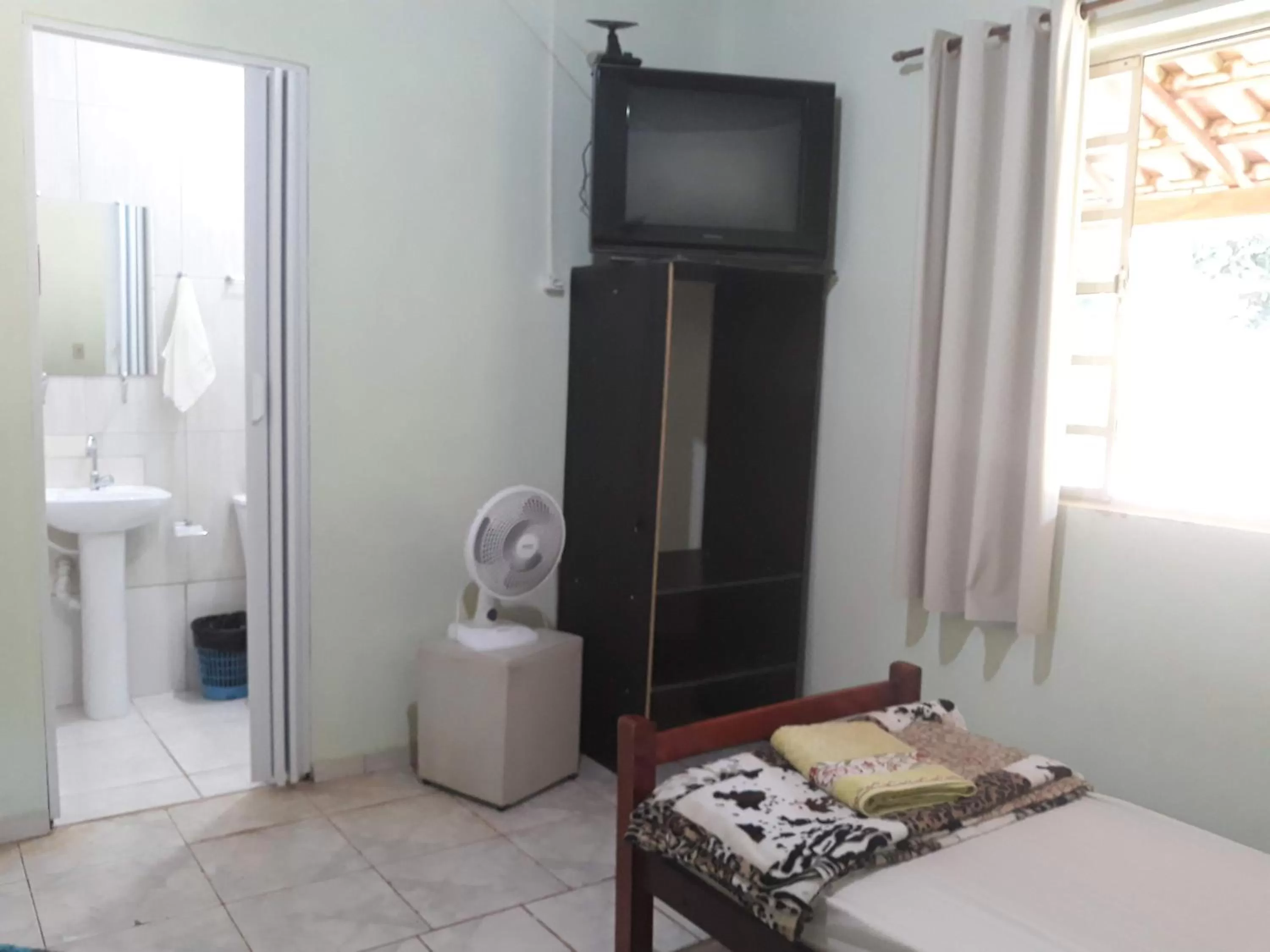 Bed in Pousada do Ribeirão